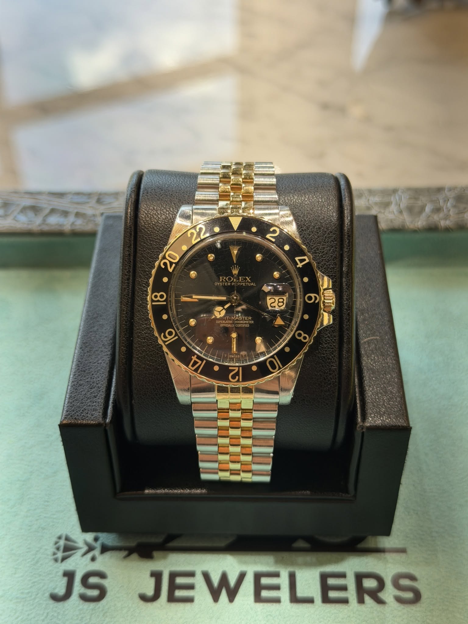 May be an image of wrist watch and text