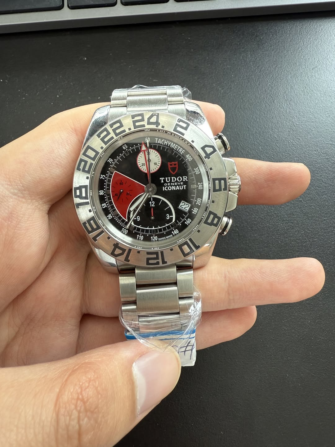 May be an image of wrist watch and text