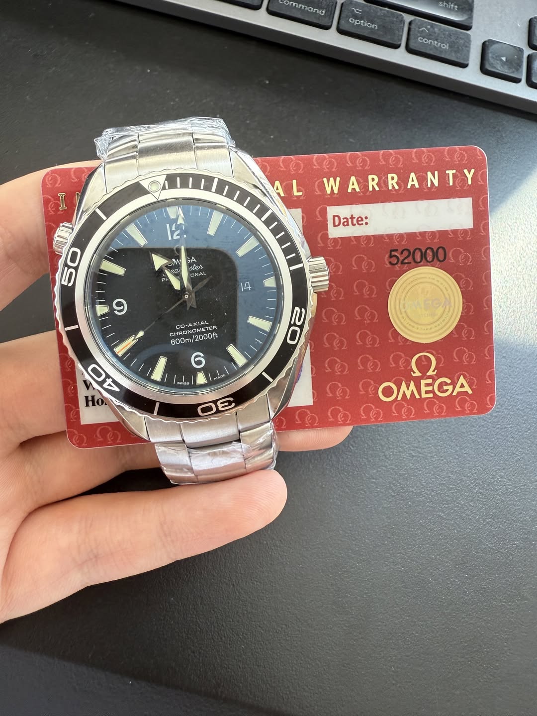 May be an image of wrist watch and text that says 'ommand ل option shift controi I AL 1 12 WARRANTY Date: M GA 홍농 ب لر ခ ش 50 ซ้ 9 1A 52000 22 HRON MRONEMEN תעוהחם ipcoft…