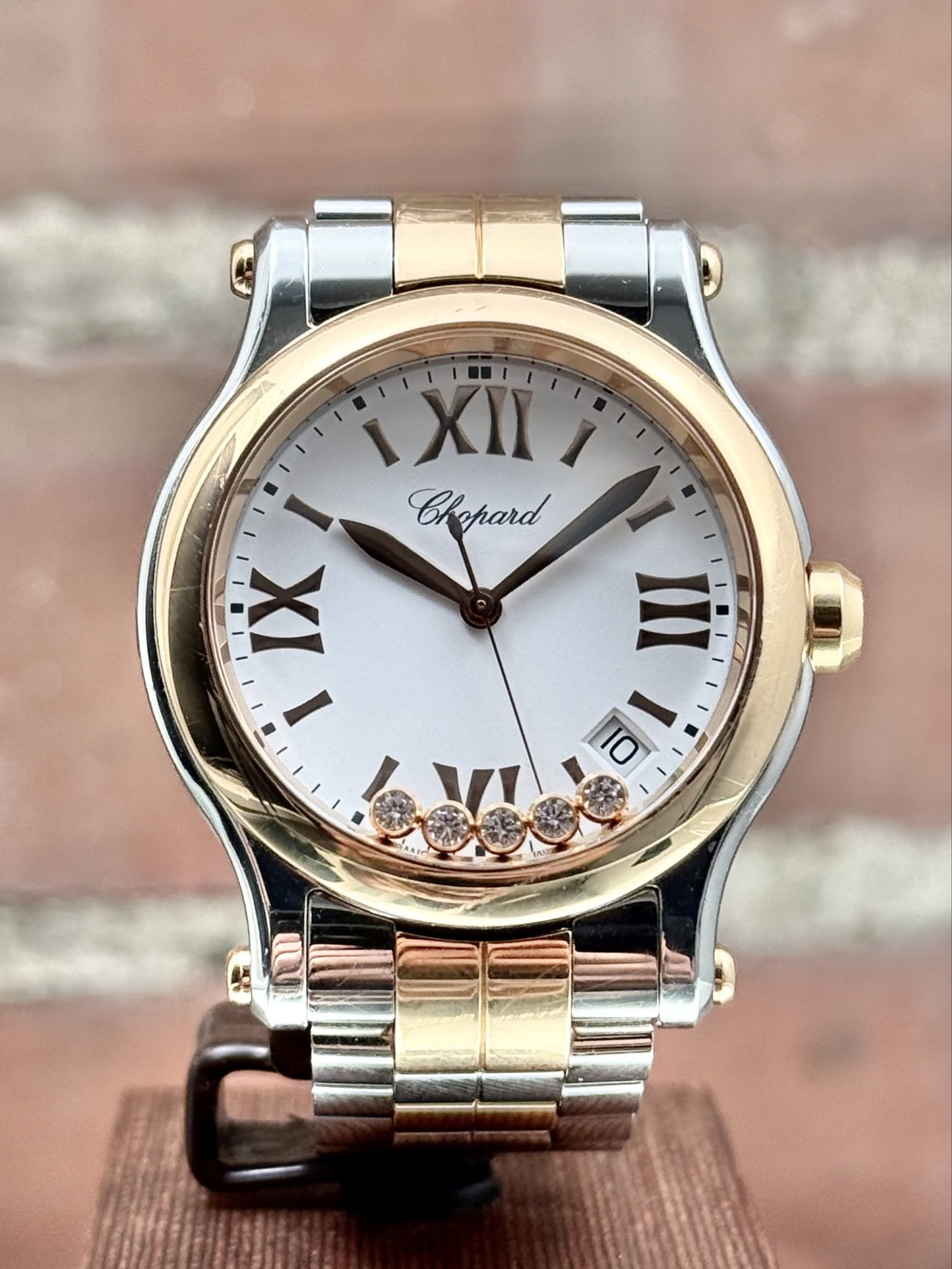 May be an image of jewelry, wrist watch and text that says 'ι Eghard Chapard I IX I III DI 10 1'