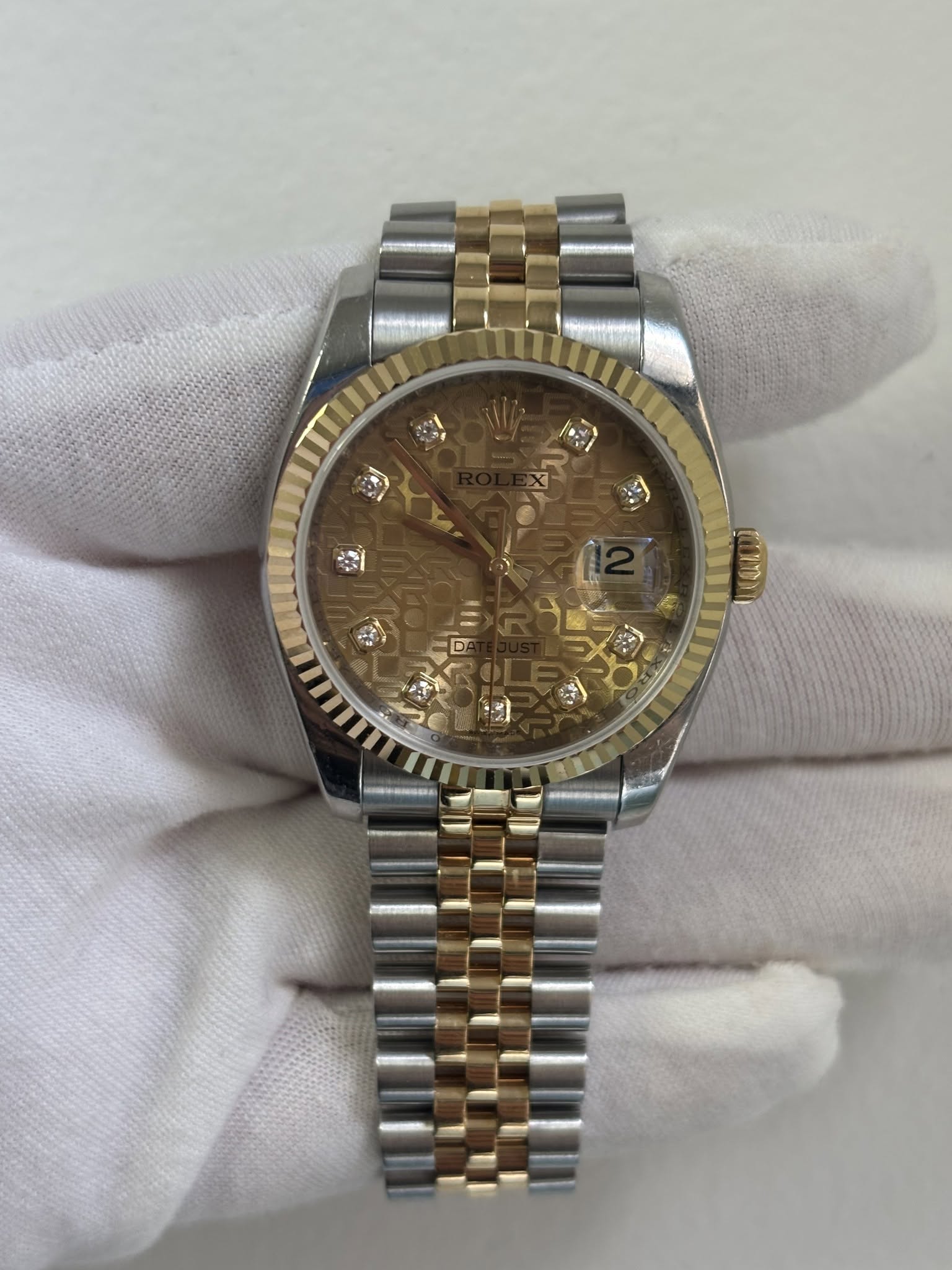 May be an image of wrist watch and text