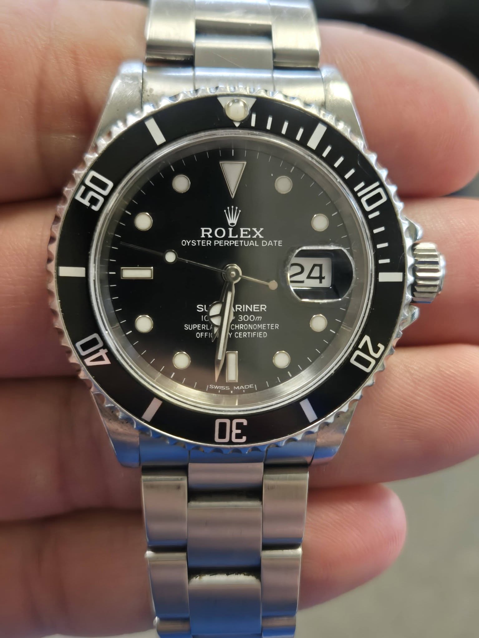 May be an image of wrist watch and text that says '50 10 ROLEX OYS OYSTERPERPETUALDATE ER PERPETUAL DATE 24 4 SL SUPERL OFFI RINER 300pTp CHRONOME TER CERTIFIED 40 SS5 20 DE'