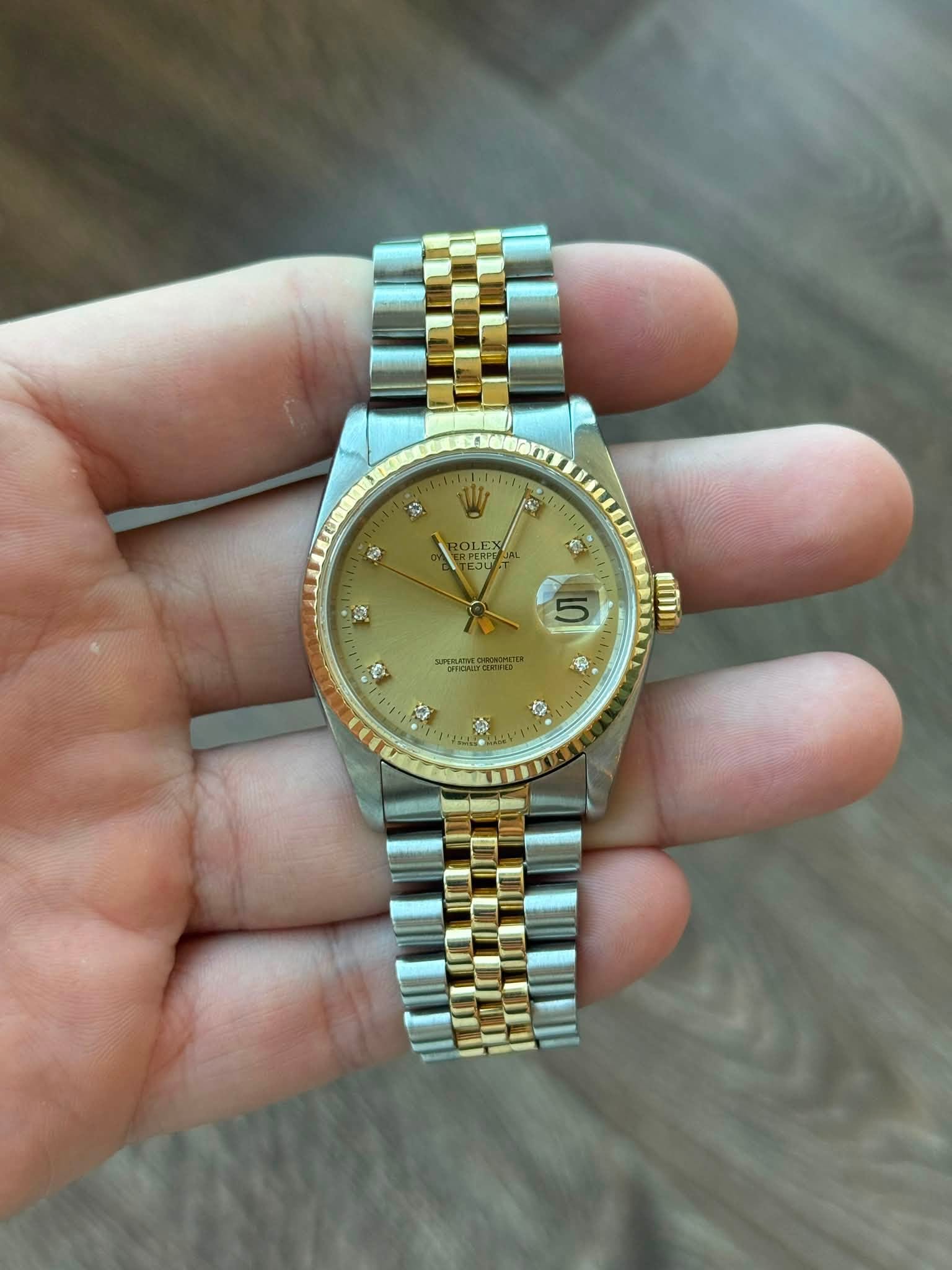 May be an image of wrist watch and text