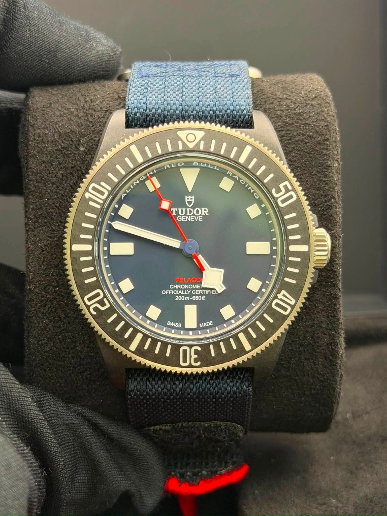 May be an image of wrist watch and text that says 'RED BULL B0 10 ه RA C IN N 50 TUDOR GENEVE PELAGO OFF OFFICALLCERTIFIEL OFFICIALLY OFFICIALLYC CHRONOMET CHRONOME CERTIFIEL…