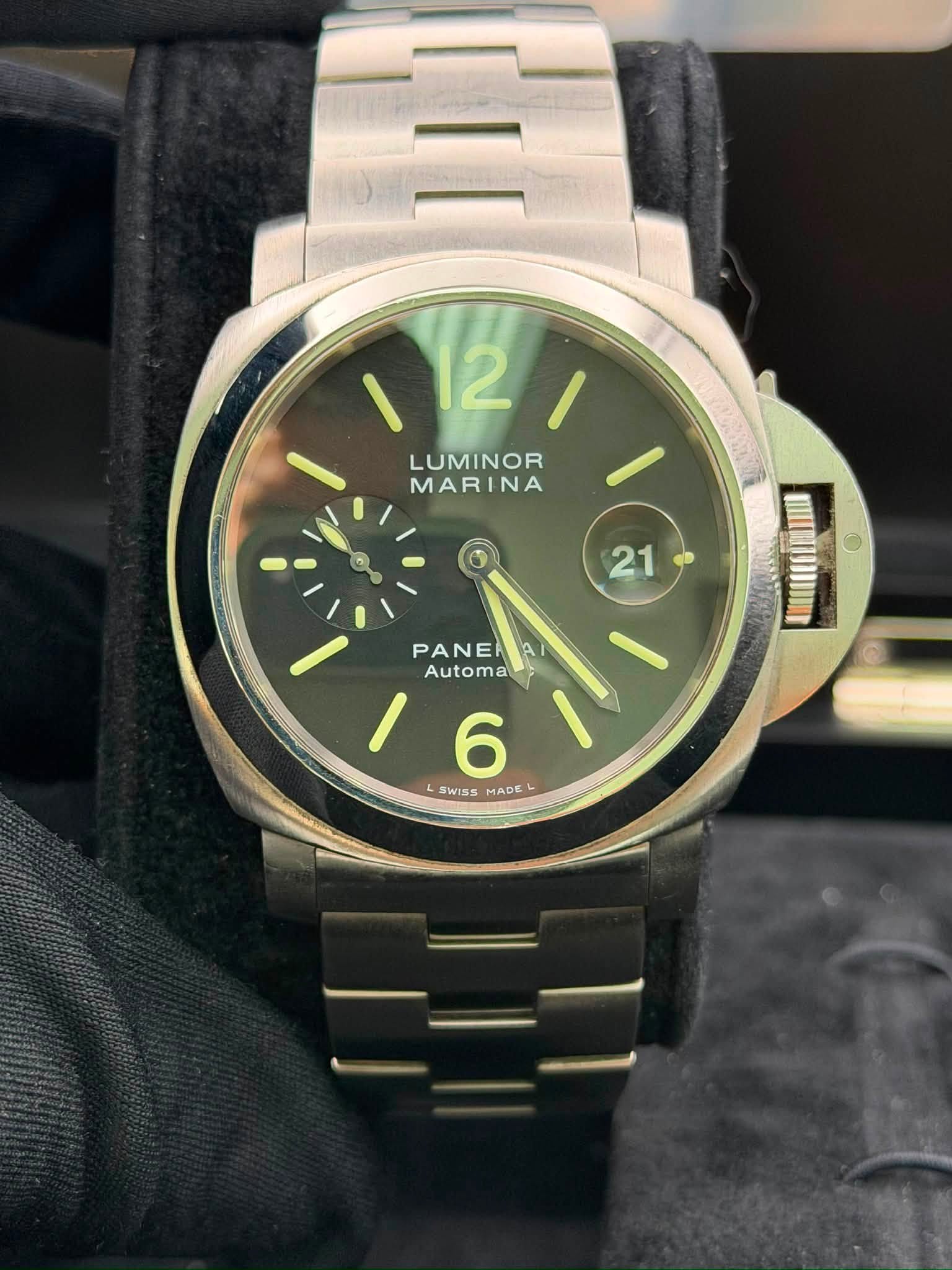 May be an image of wrist watch and text