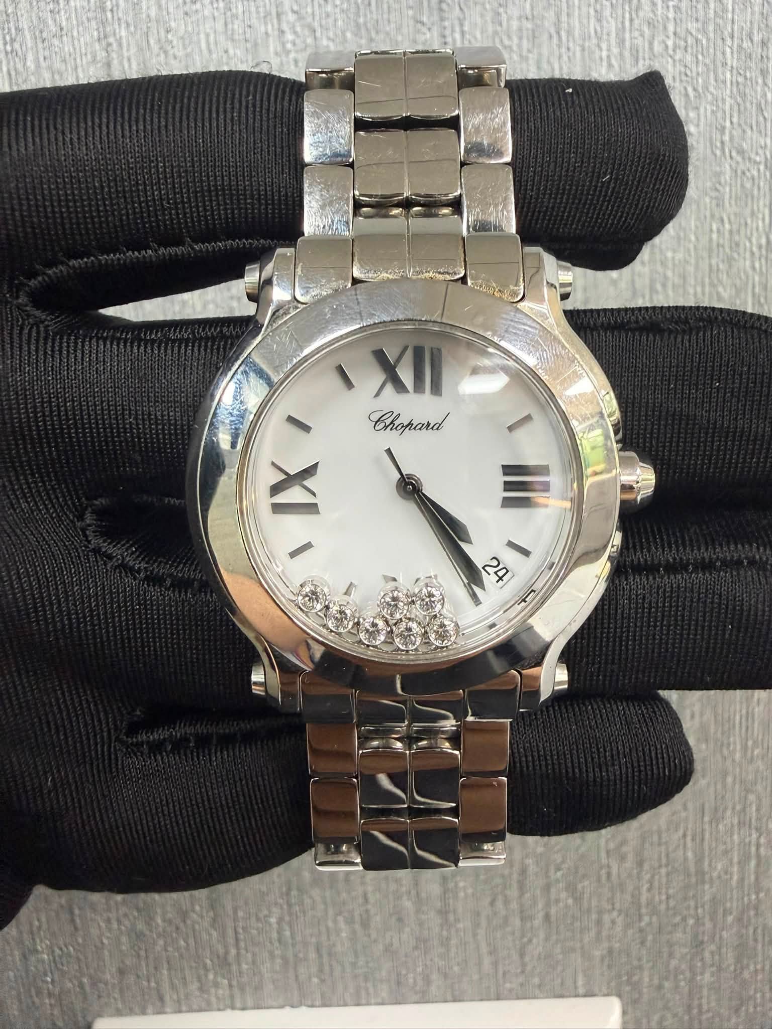 May be an image of wrist watch and text