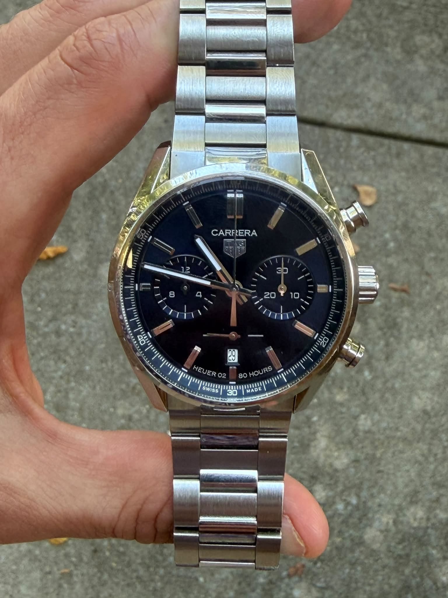 May be an image of wrist watch and text