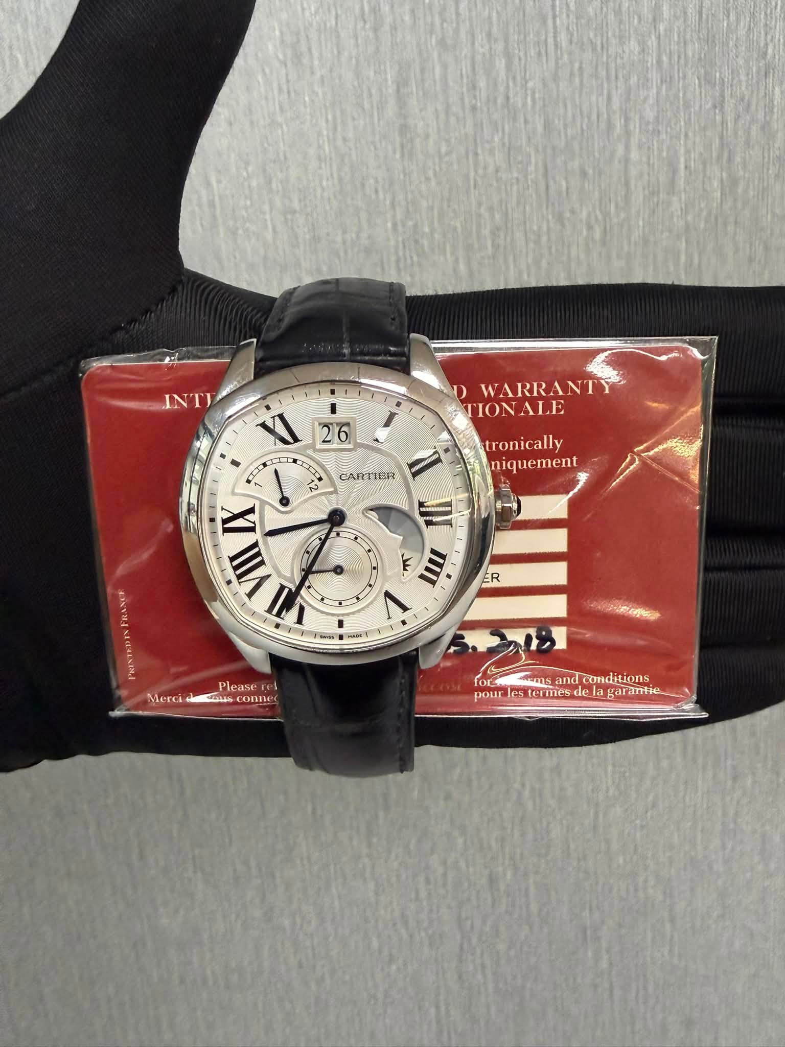 May be an image of wrist watch and text