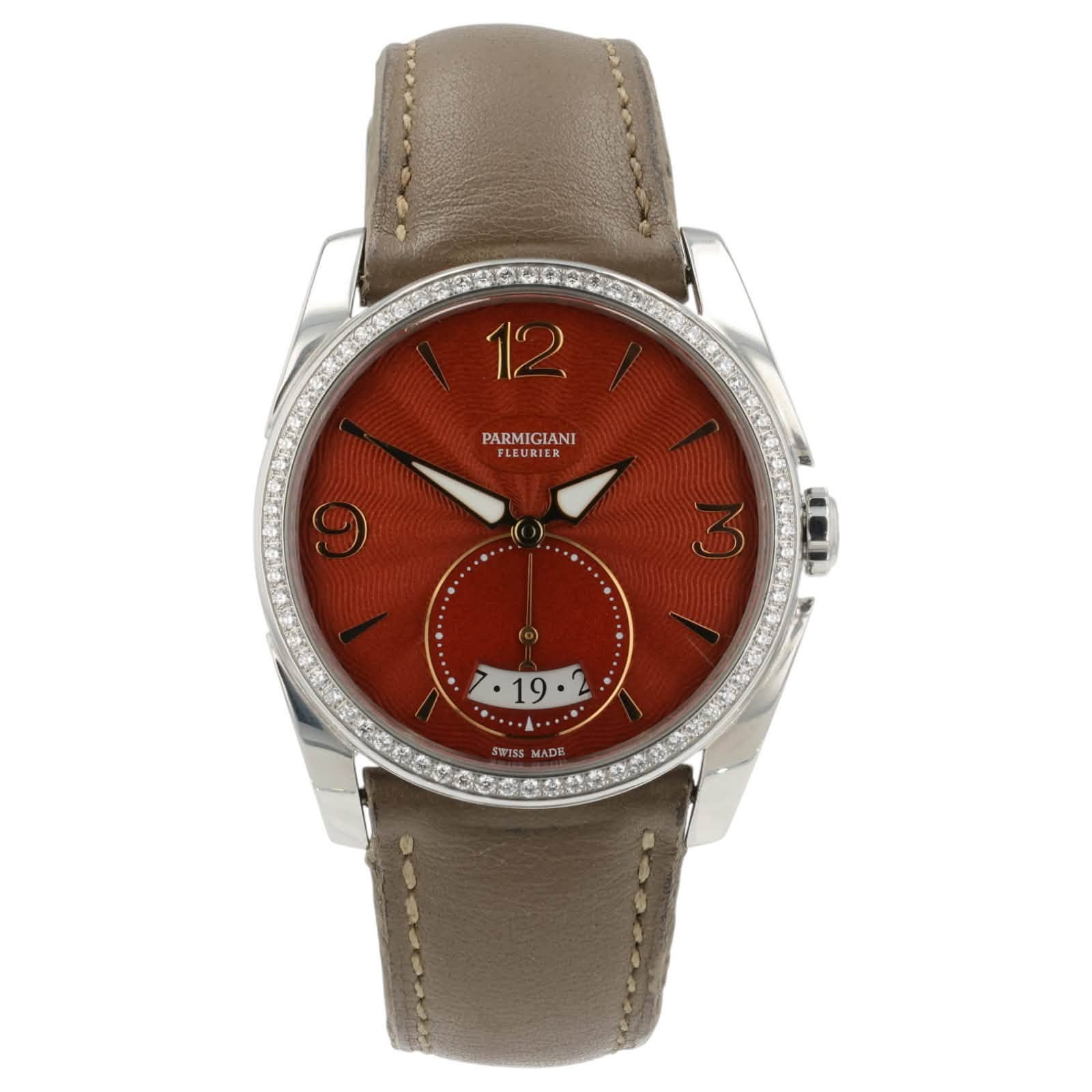 May be an image of wrist watch, leather and text