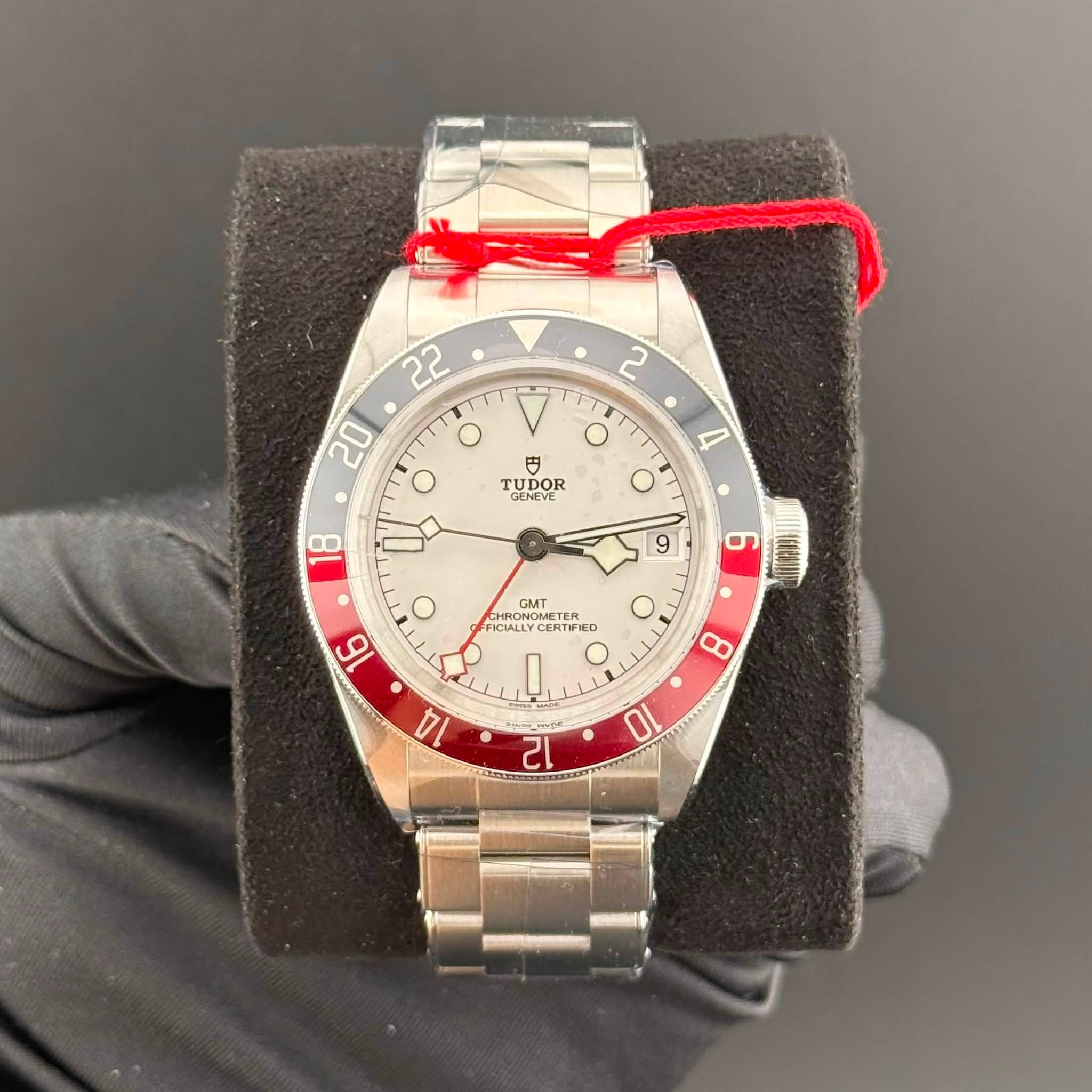 May be an image of wrist watch and text