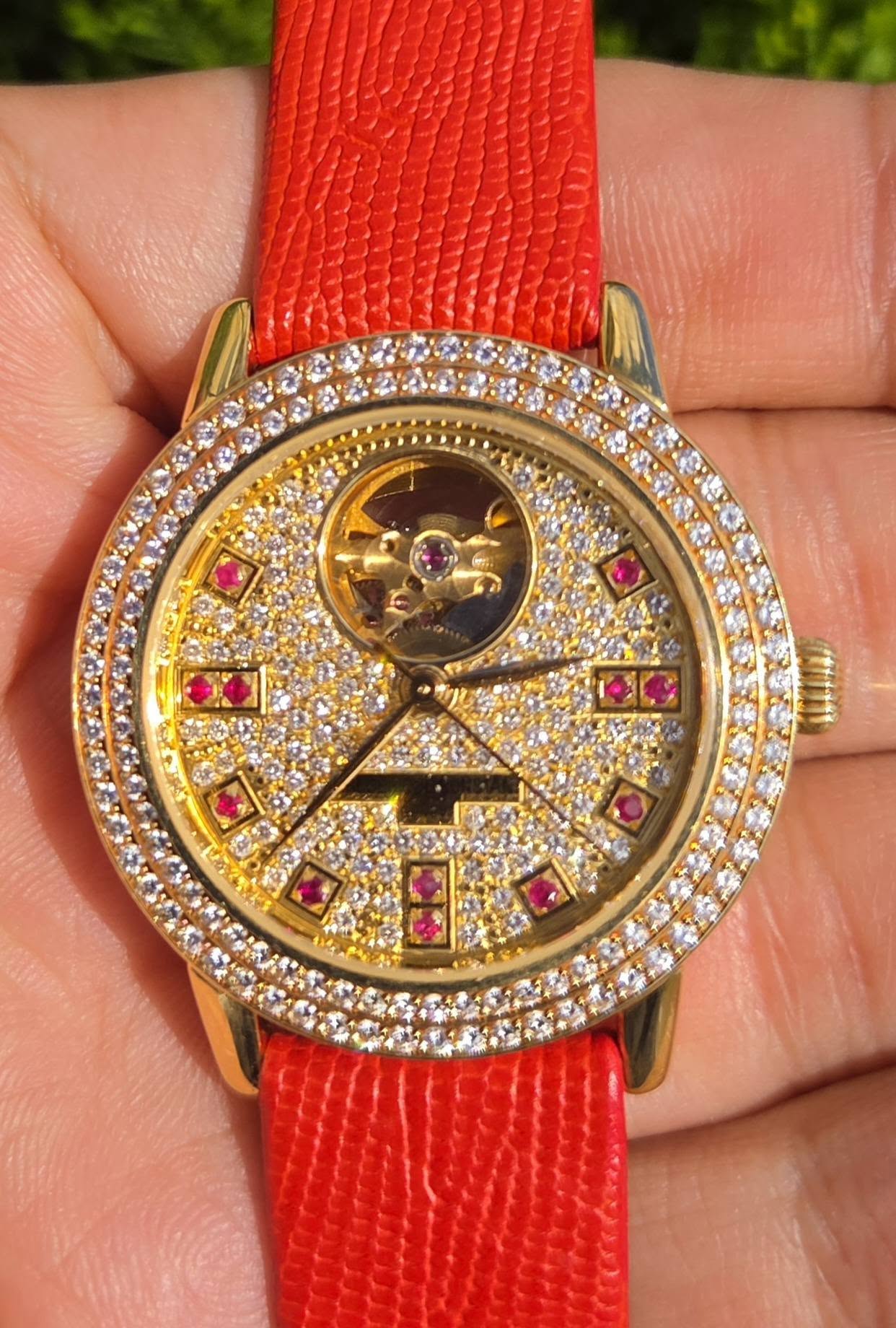 May be an image of wrist watch and text