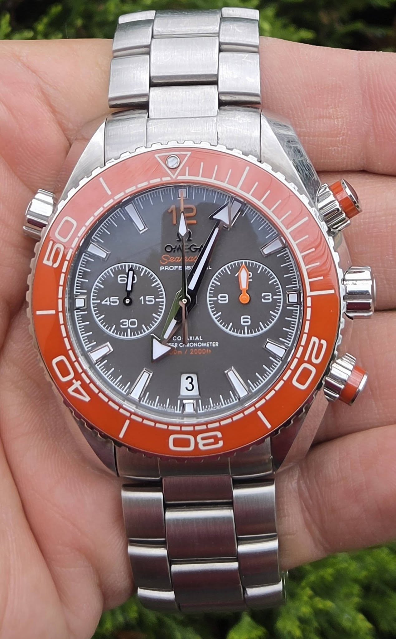 May be an image of wrist watch and text