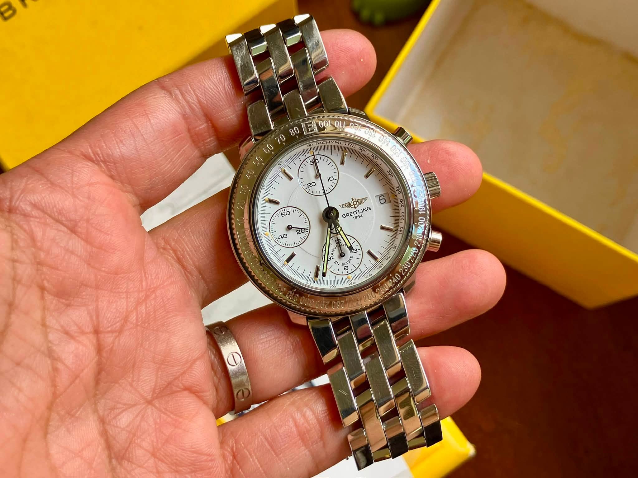 May be an image of wrist watch and text