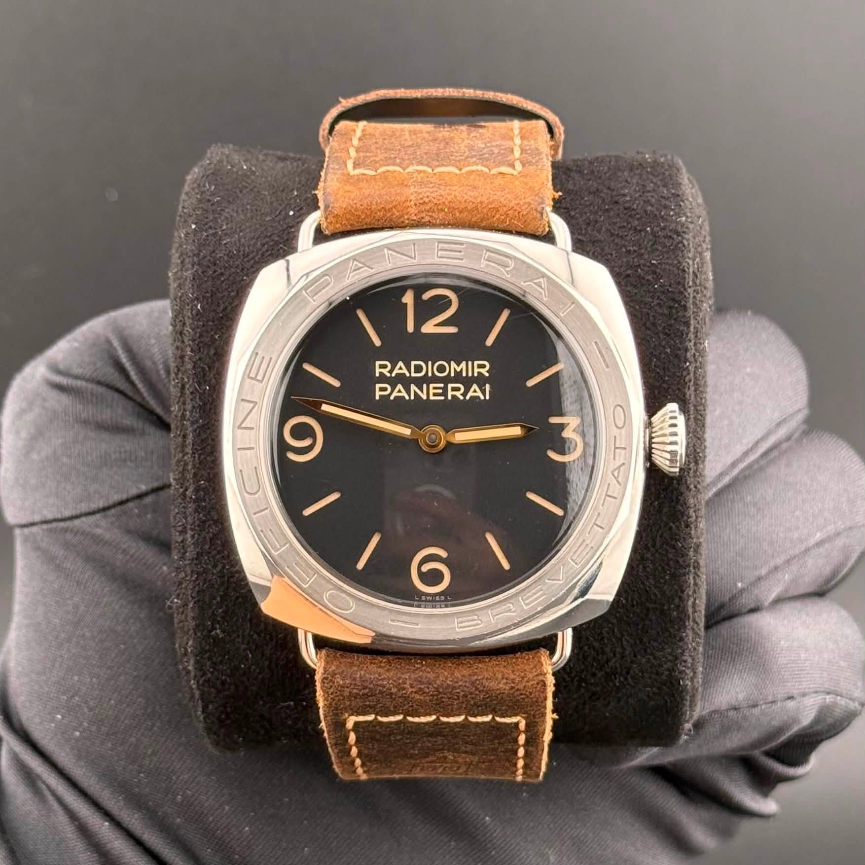 May be an image of leather, wrist watch and text