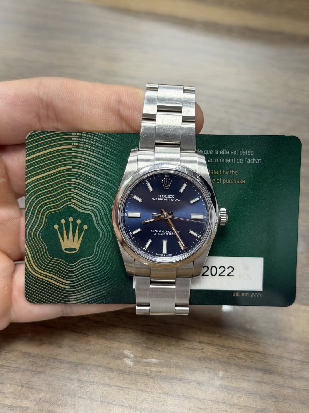 May be an image of wrist watch and text