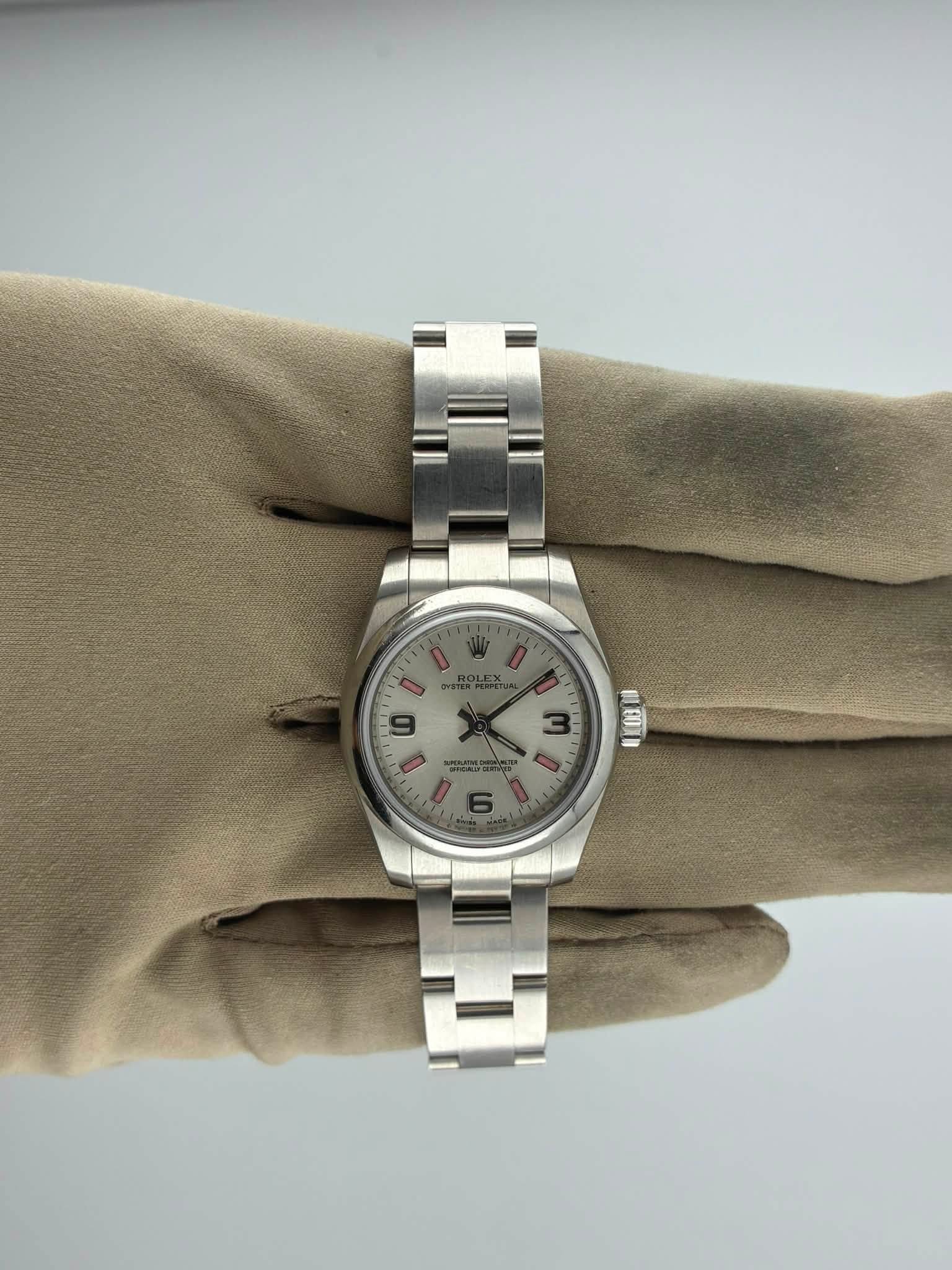 May be an image of wrist watch and text