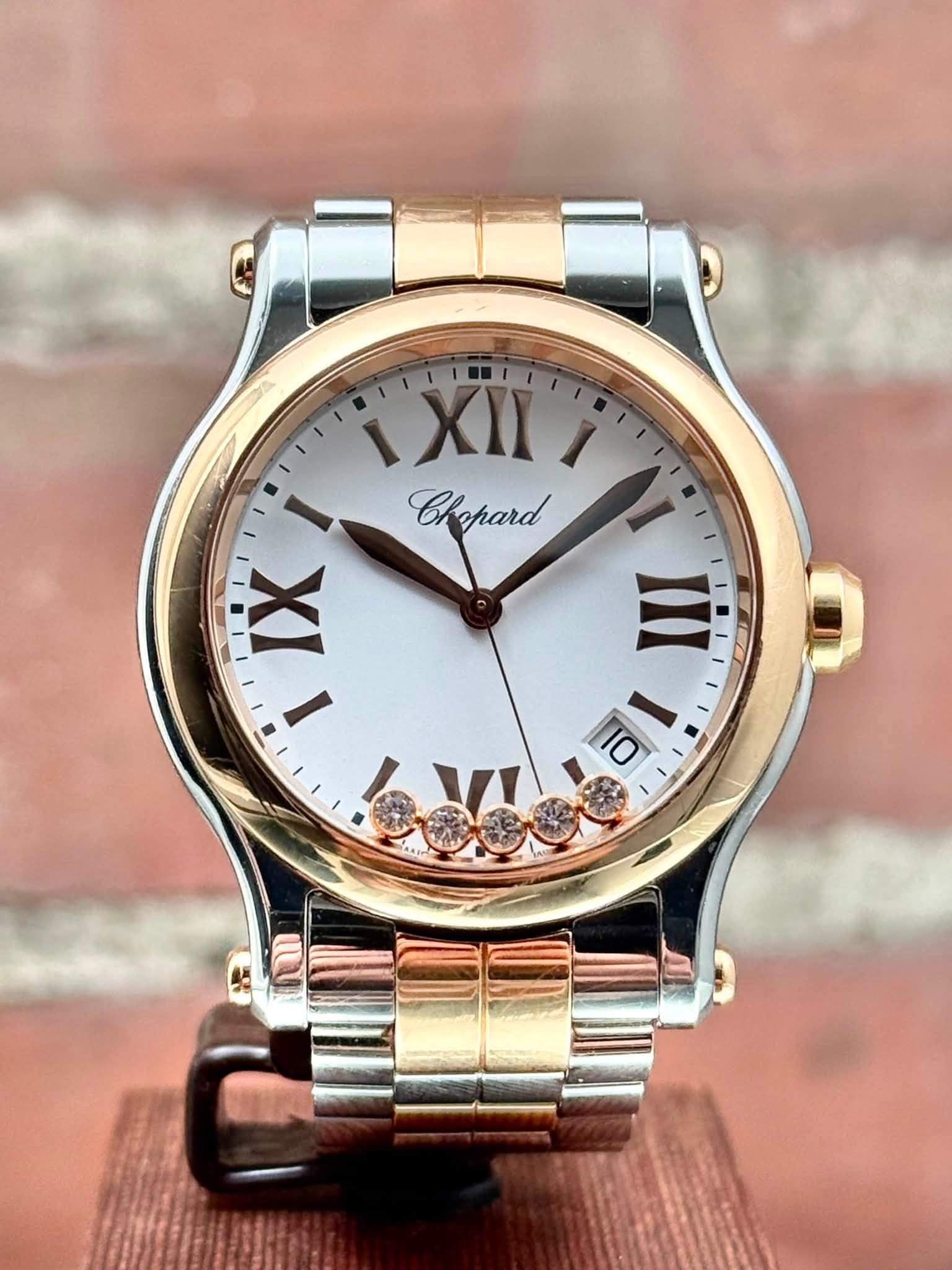 May be an image of jewelry, wrist watch and text