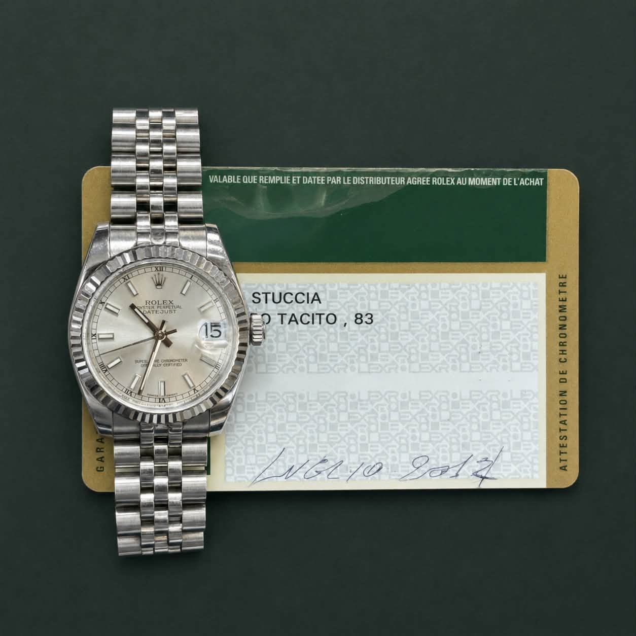 May be an image of wrist watch and text that says 'WUMETETETERTRTE MOMEN DEL ACHAT VALABLE REMPLIE DATEE DISTRIBUTEUR ISTRIBU LIT ROLETun I 15 MS STUCCIA P TACITO 83 .메한한…