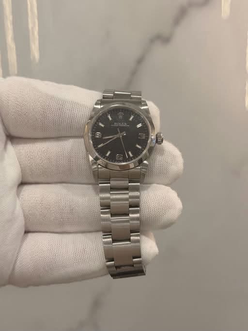 May be an image of wrist watch and text