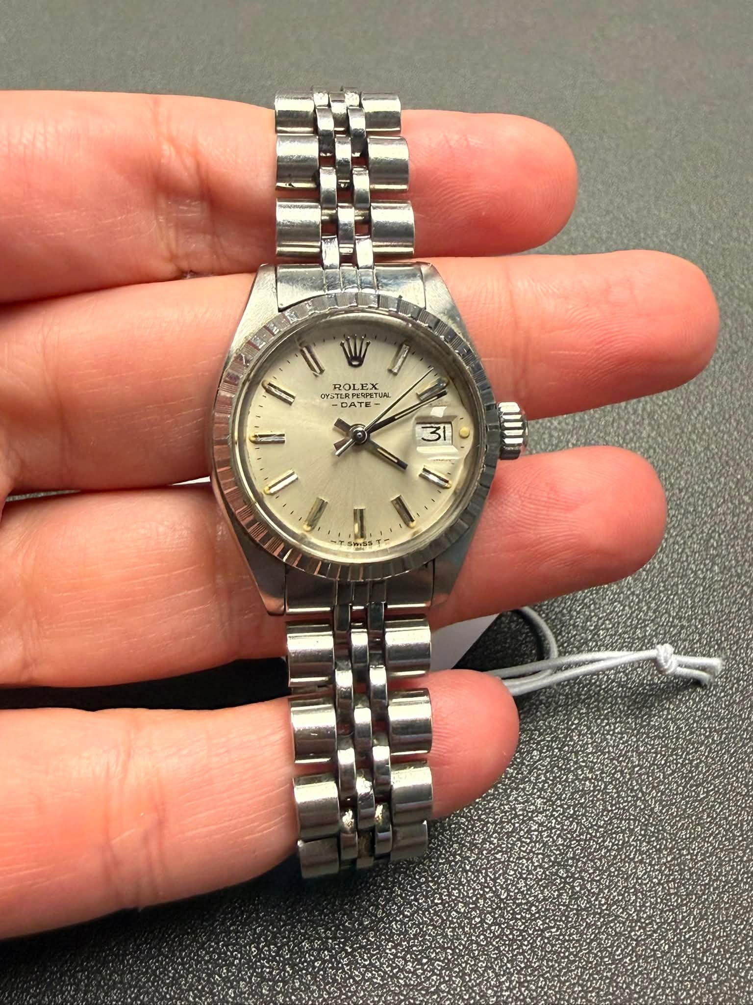 May be an image of wrist watch and text that says 'I W Il ROL A ROLEX GYSTI GYSTE OY TERPERPE -BATE כחד DAY TERPERPET PTRPETИA PERPETCA PΩ DATE TE- Α 31'