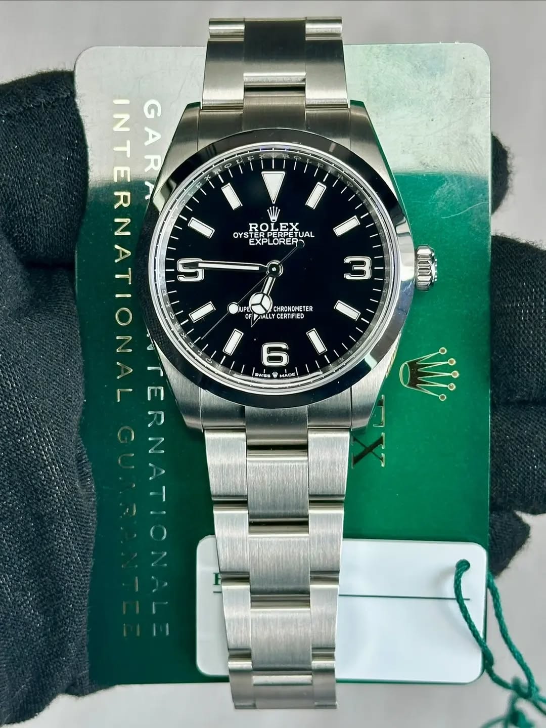 May be an image of wrist watch and text that says 'INTERNATION ย ጣ ১ INTER INT R GARA 7 GA 2 ဟု LE+ OYS ERPERED UAL ROETUA EX EXPLORER UPL W CHRONOMETER METER AALL LLY CERTIFIED m…