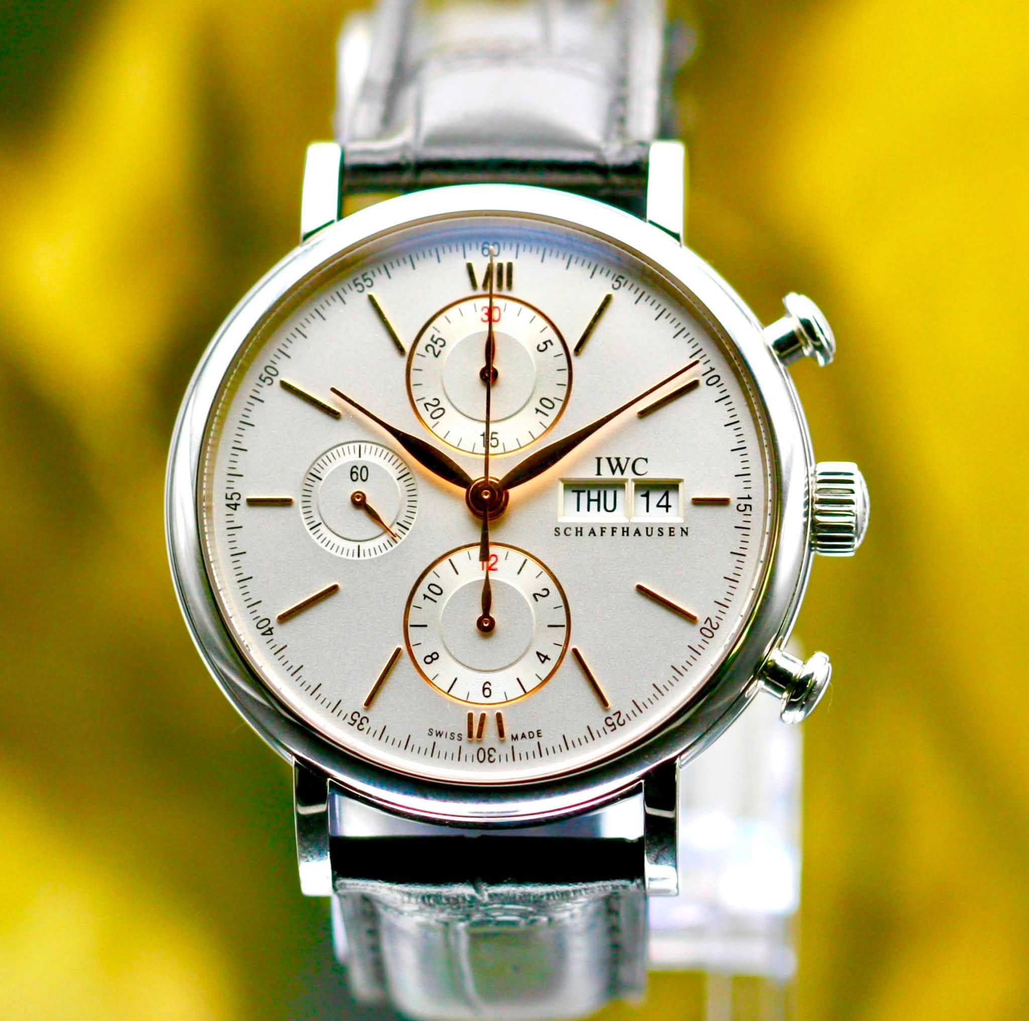 May be an image of wrist watch and text that says ' O 5 60 E P IWC THU 14 SCHAFFHAUSEN SCH 10 م 8 4 20 6 SWISS MADE ADE 9ι باي ΟΕι'