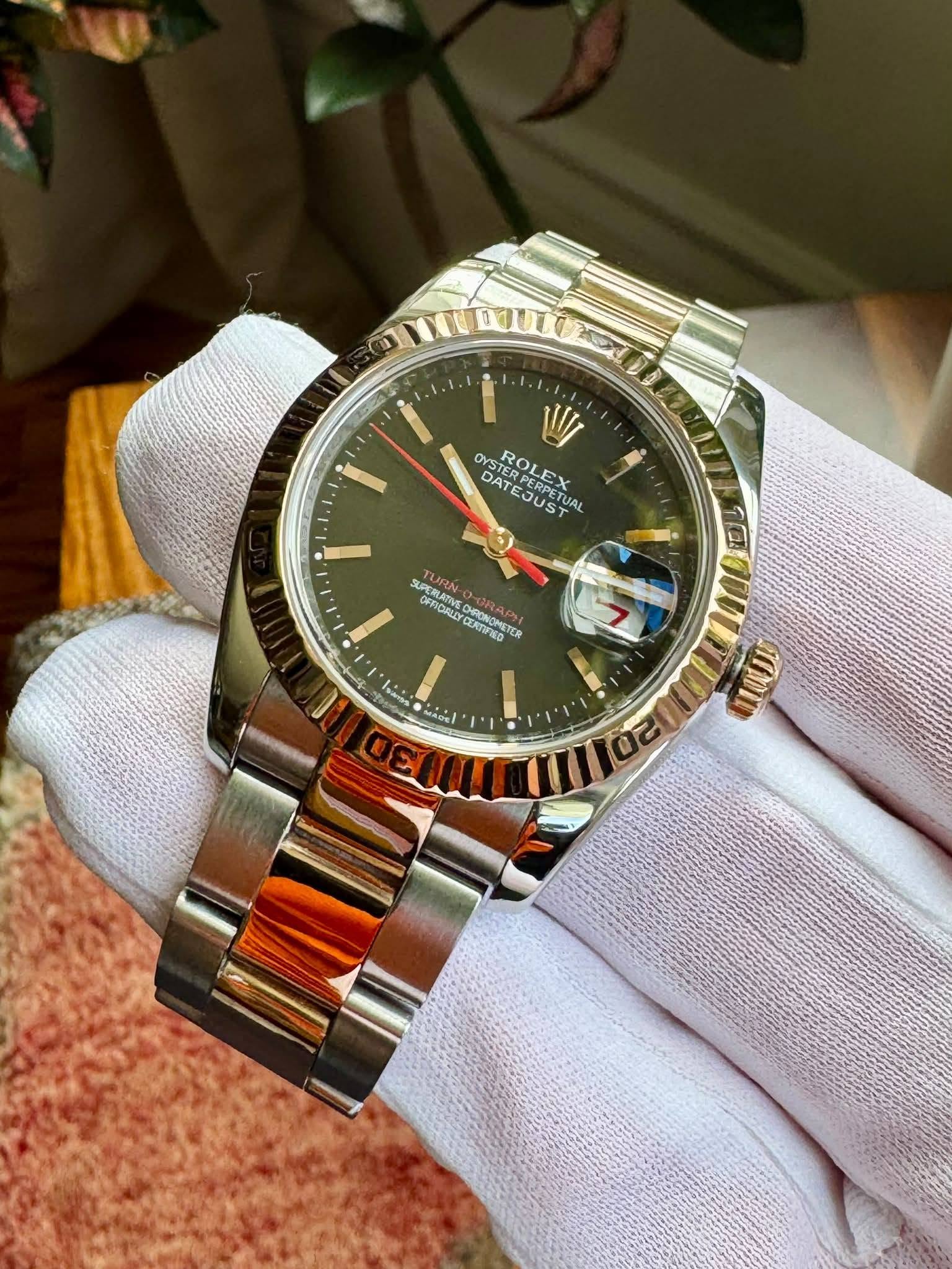 May be an image of wrist watch and text