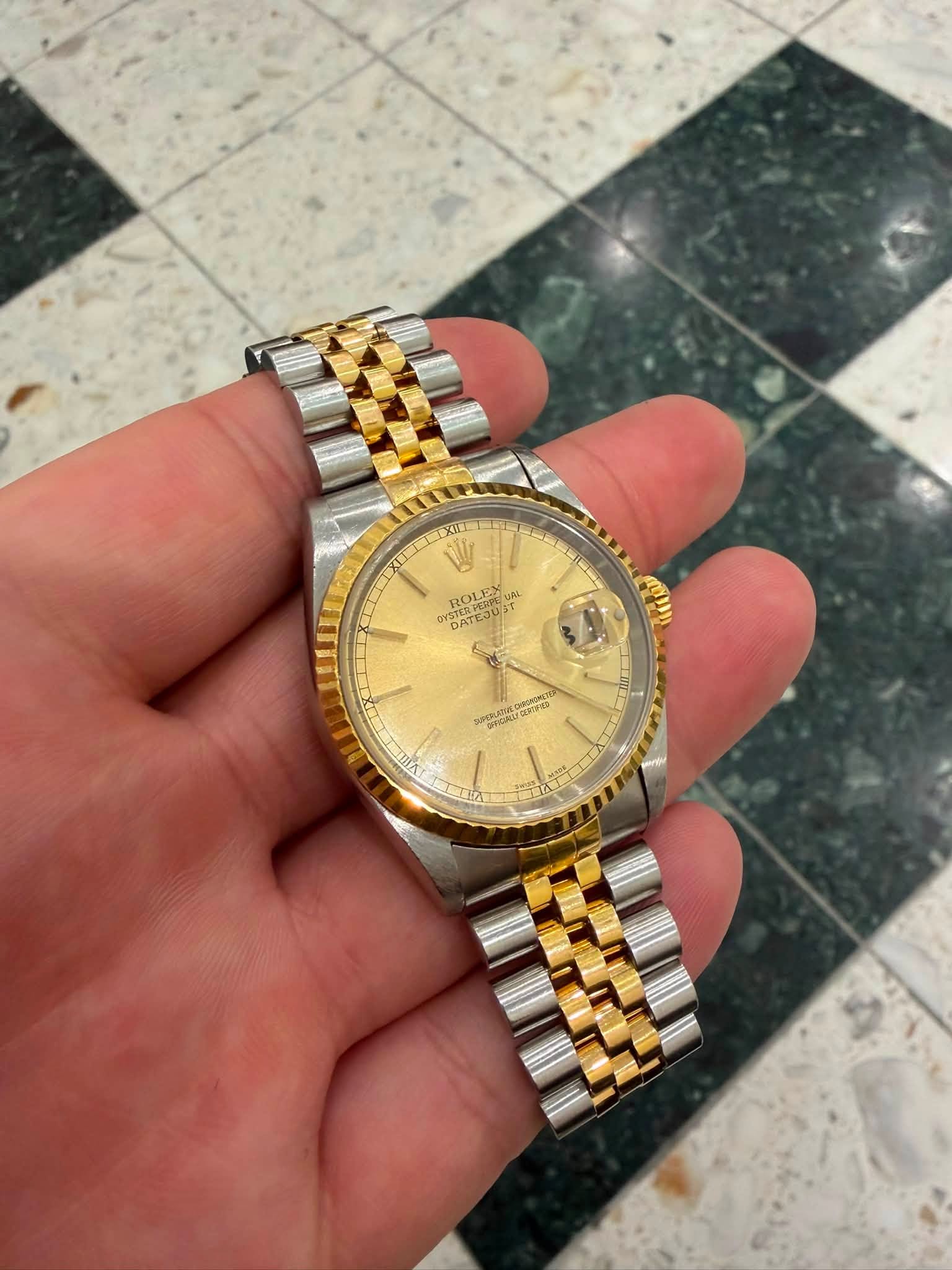 May be an image of wrist watch and text