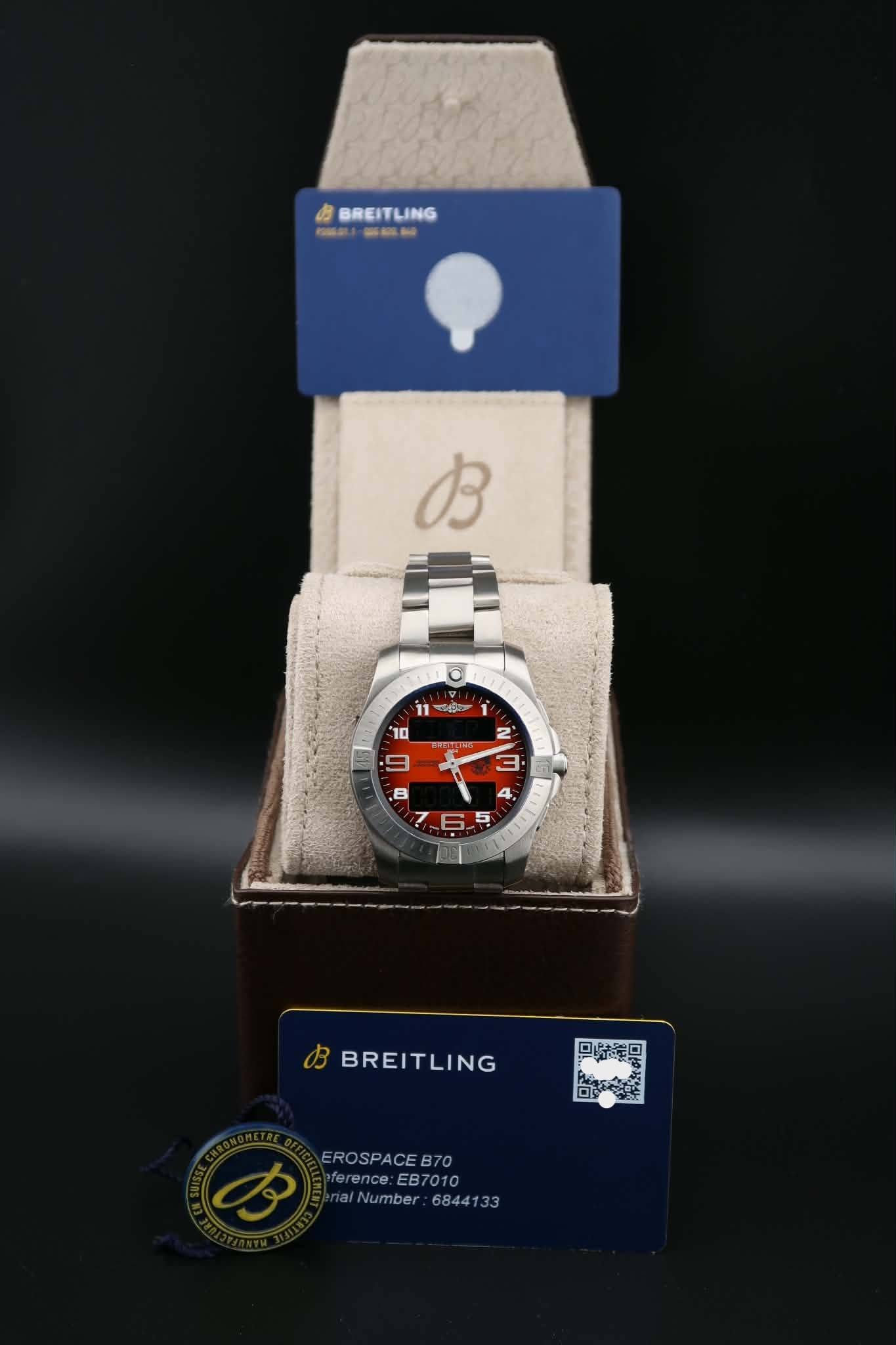 May be an image of digital watch and text that says 'お BREITLING RIAO お 11 p 10 2' S 5 L B BREITLING ロ歸日 EROSPACEB70 70 eference: :EB7010 alNumber 6844133'