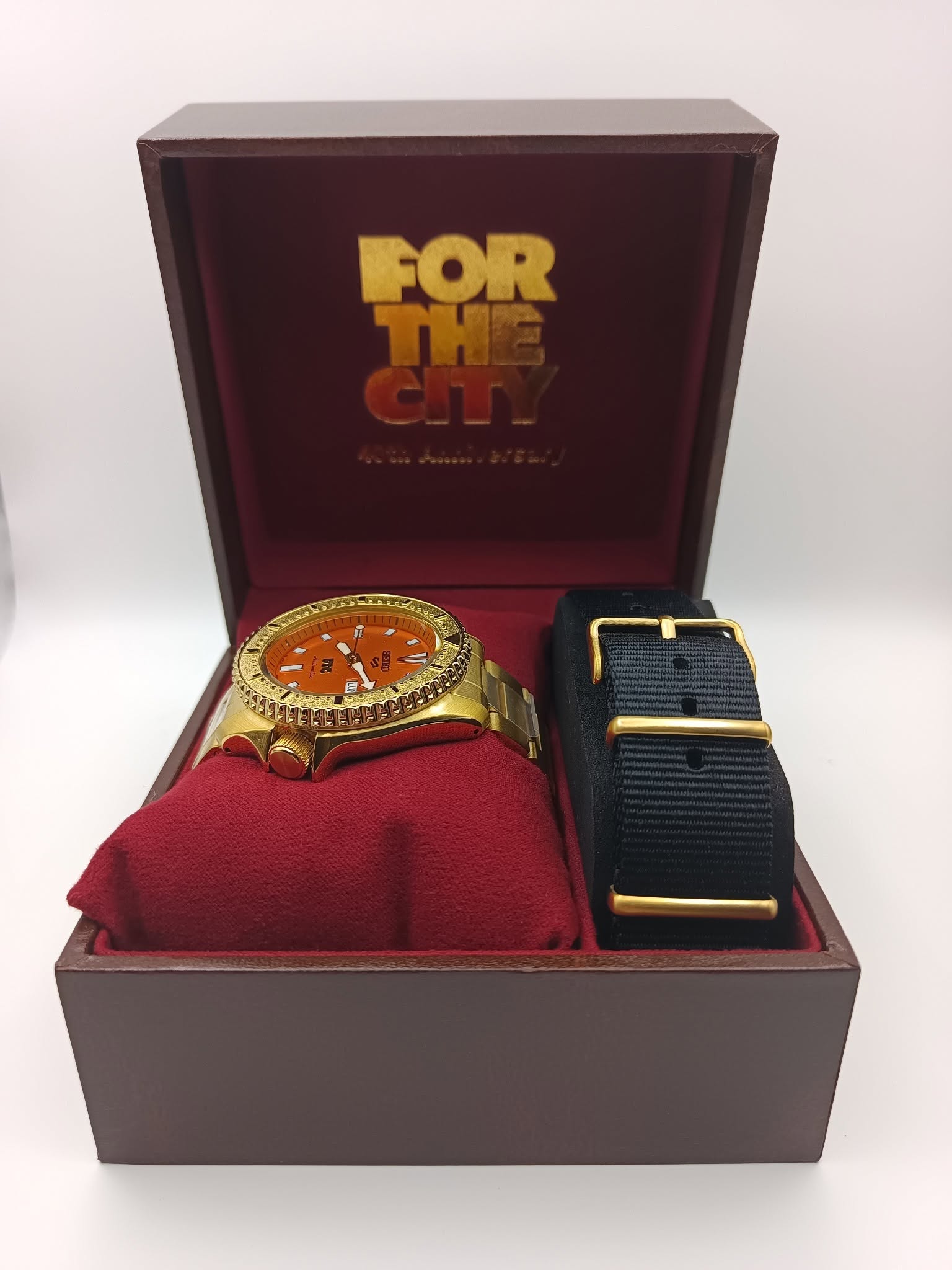 May be an image of cufflinks, wrist watch and text