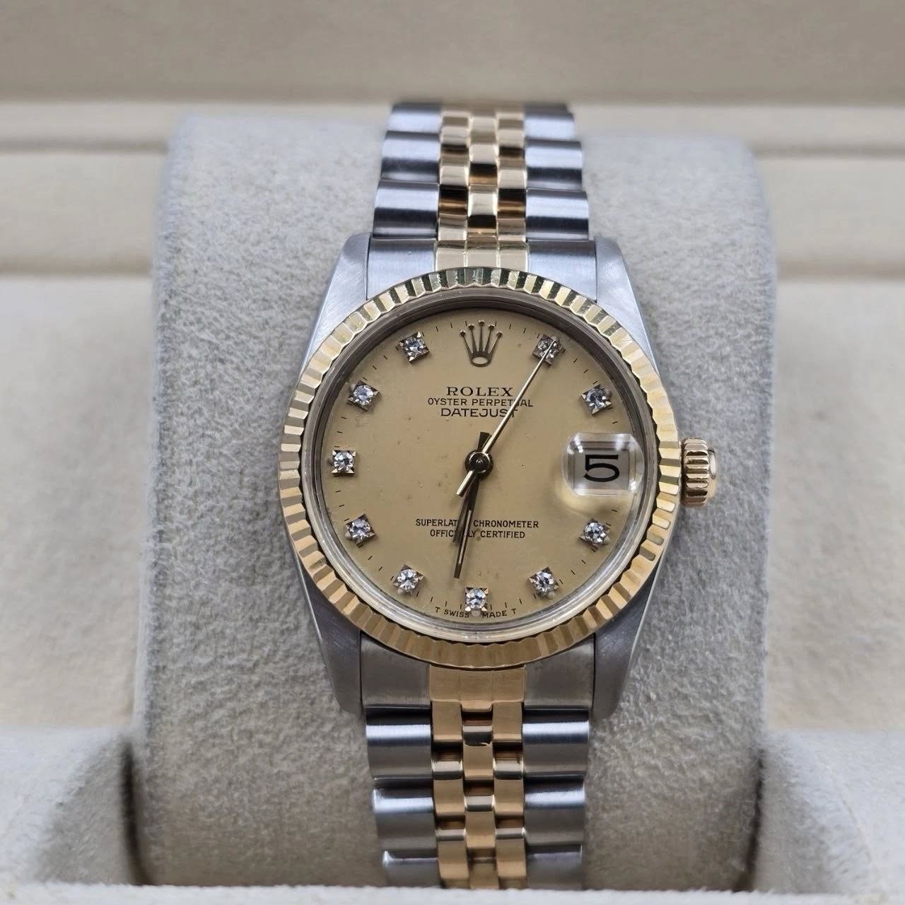 May be an image of wrist watch and text