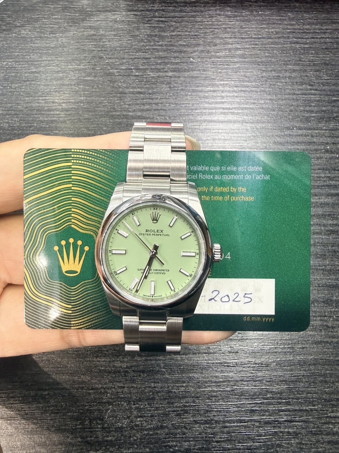 May be an image of wrist watch and text
