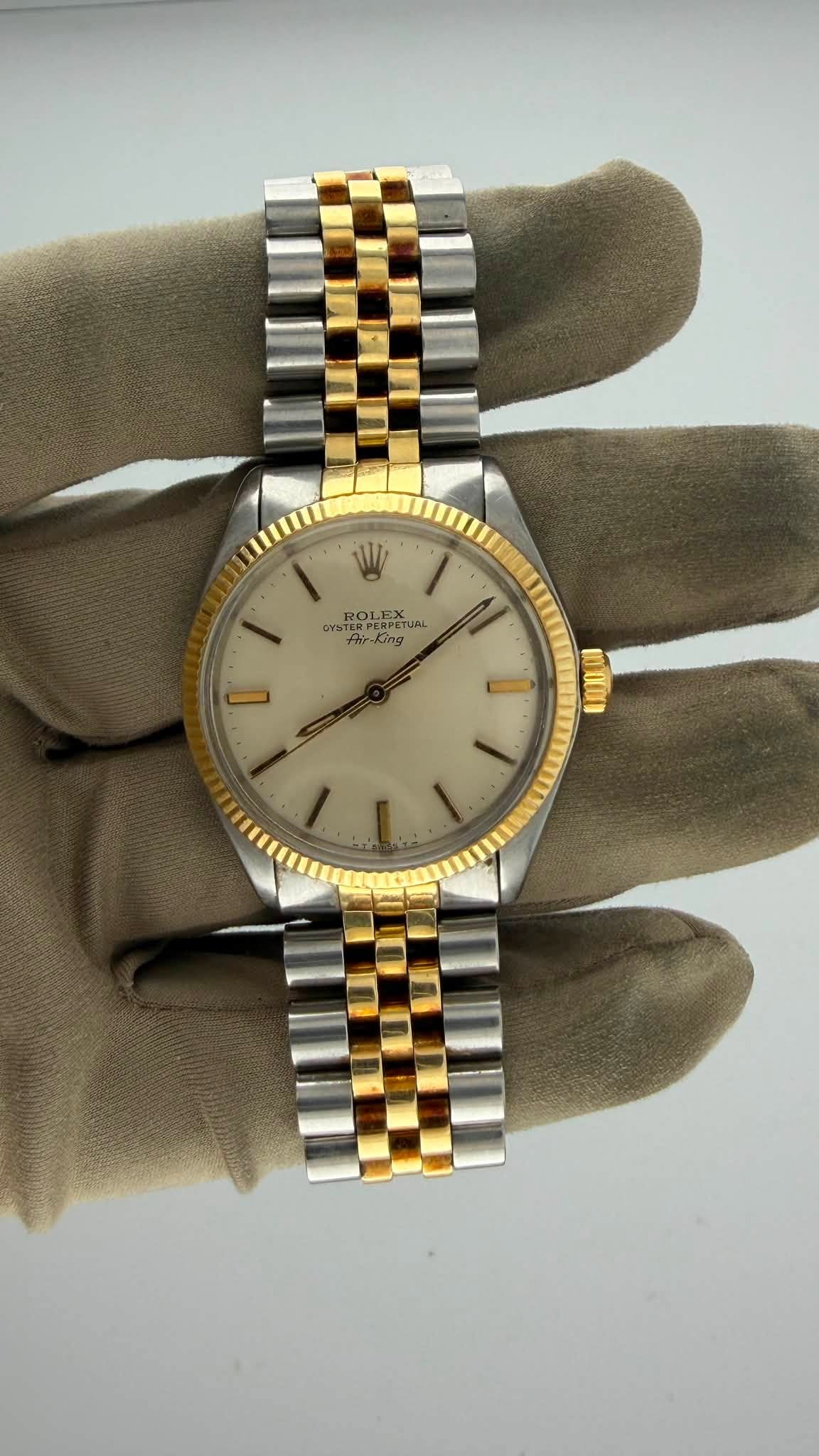 May be an image of wrist watch and text