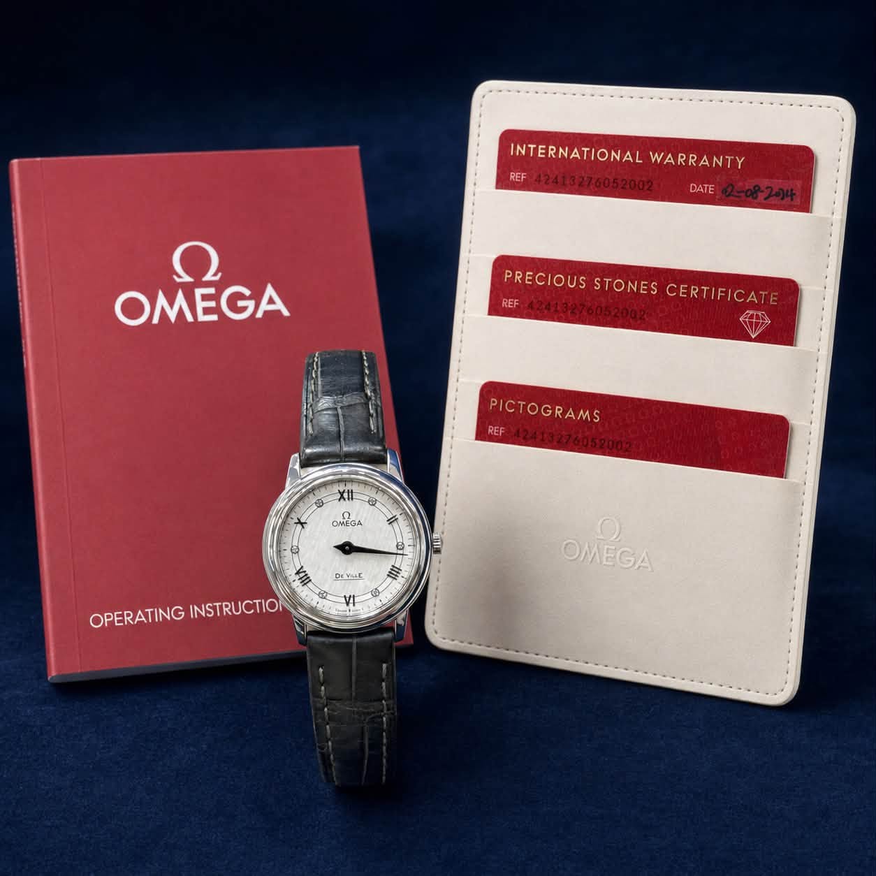 May be an image of wrist watch and text that says 'INTERNATIONAL INTERNATIONALWARRANTY WARRANTY REF / E413276052002- DATE ח OMEGA PRECIOUS STONES CERTIFICATE…
