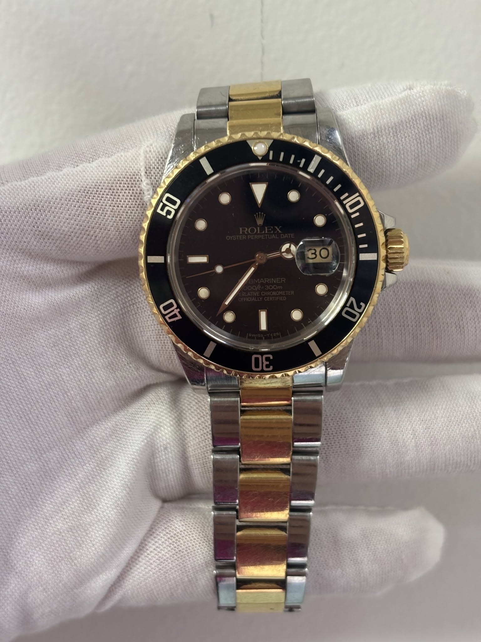 May be an image of wrist watch and text