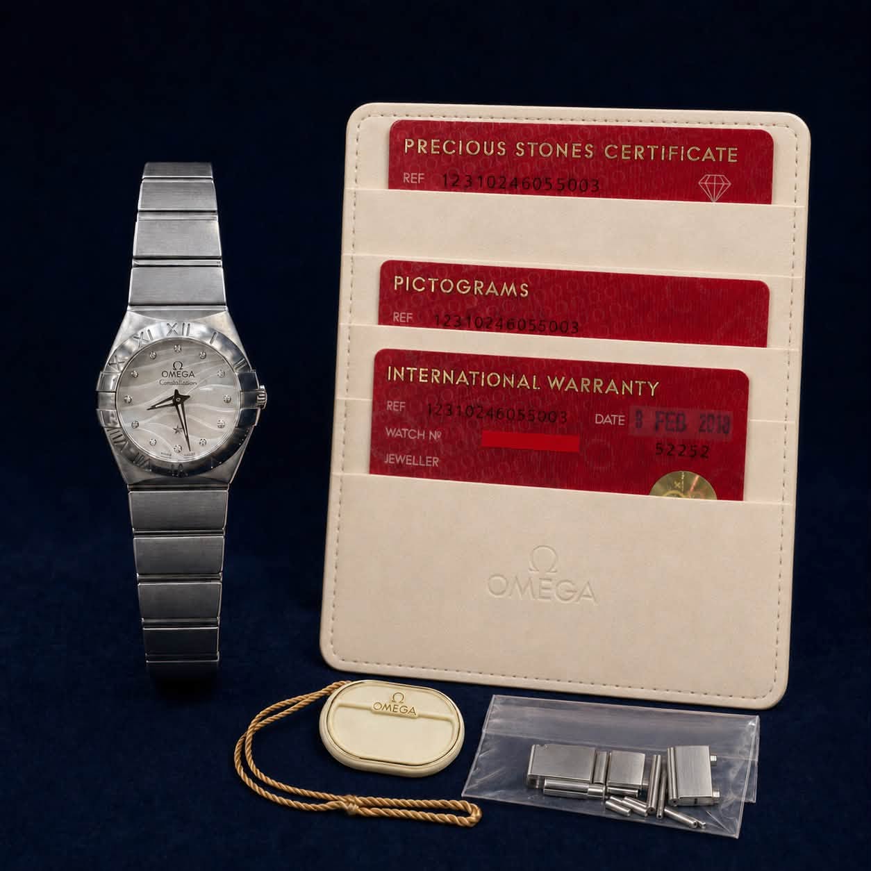May be an image of leather, leather wallet, wrist watch and text that says 'PRECIOUS STONES PRECIOUSSTONESCERTIFICATE CERTIFICATE 金 SE XII y OWECA PICTOGRAMS a 5 3 4 INTERNATIONAL…