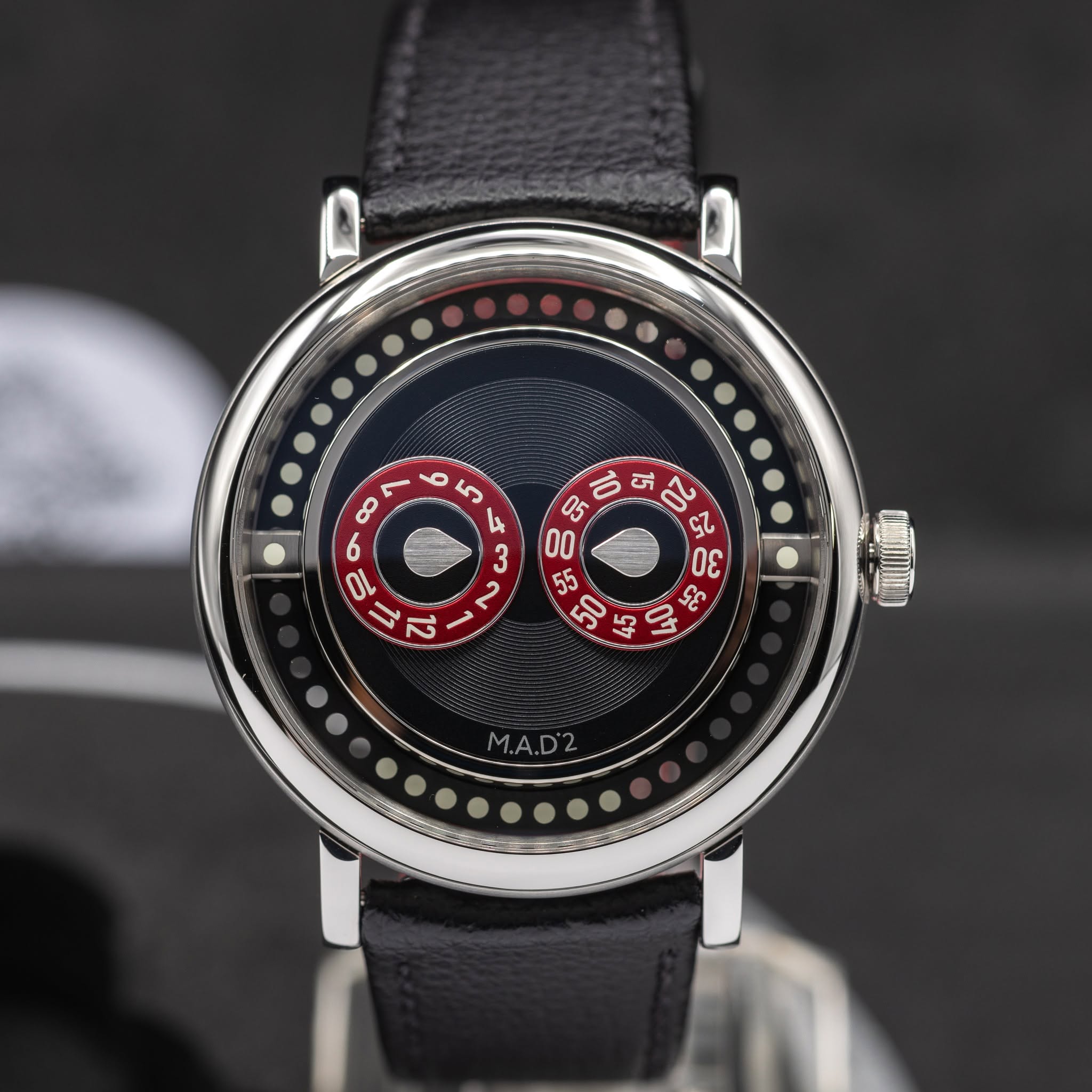 May be an image of wrist watch and text