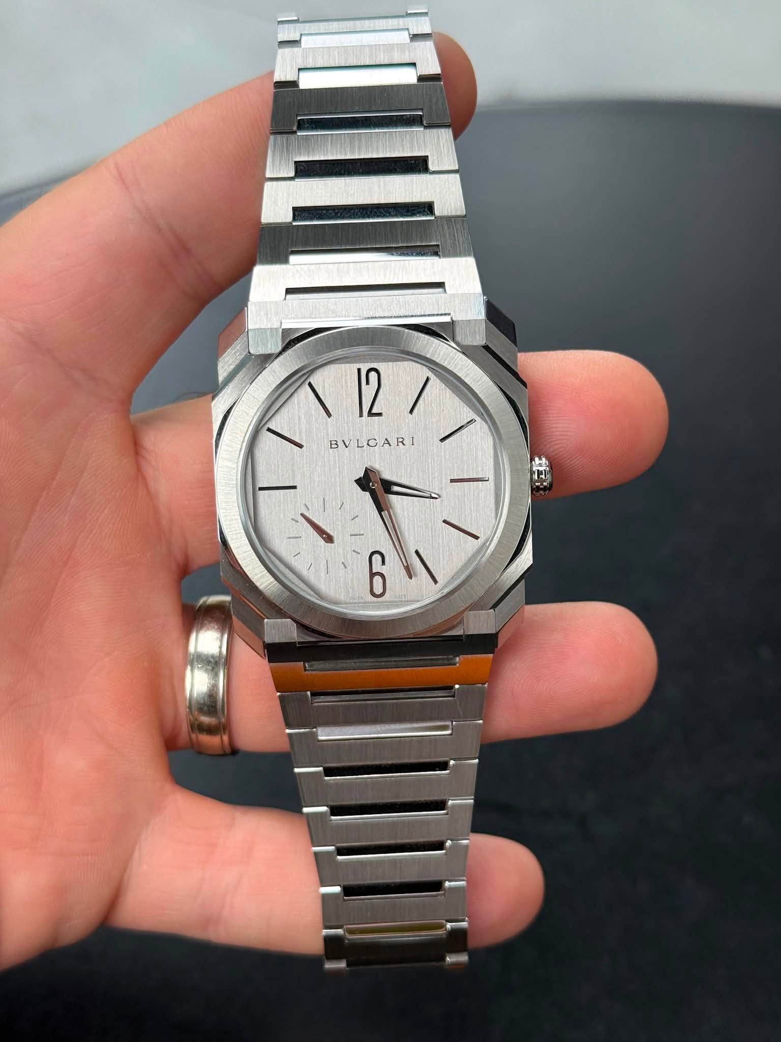 May be an image of wrist watch and text