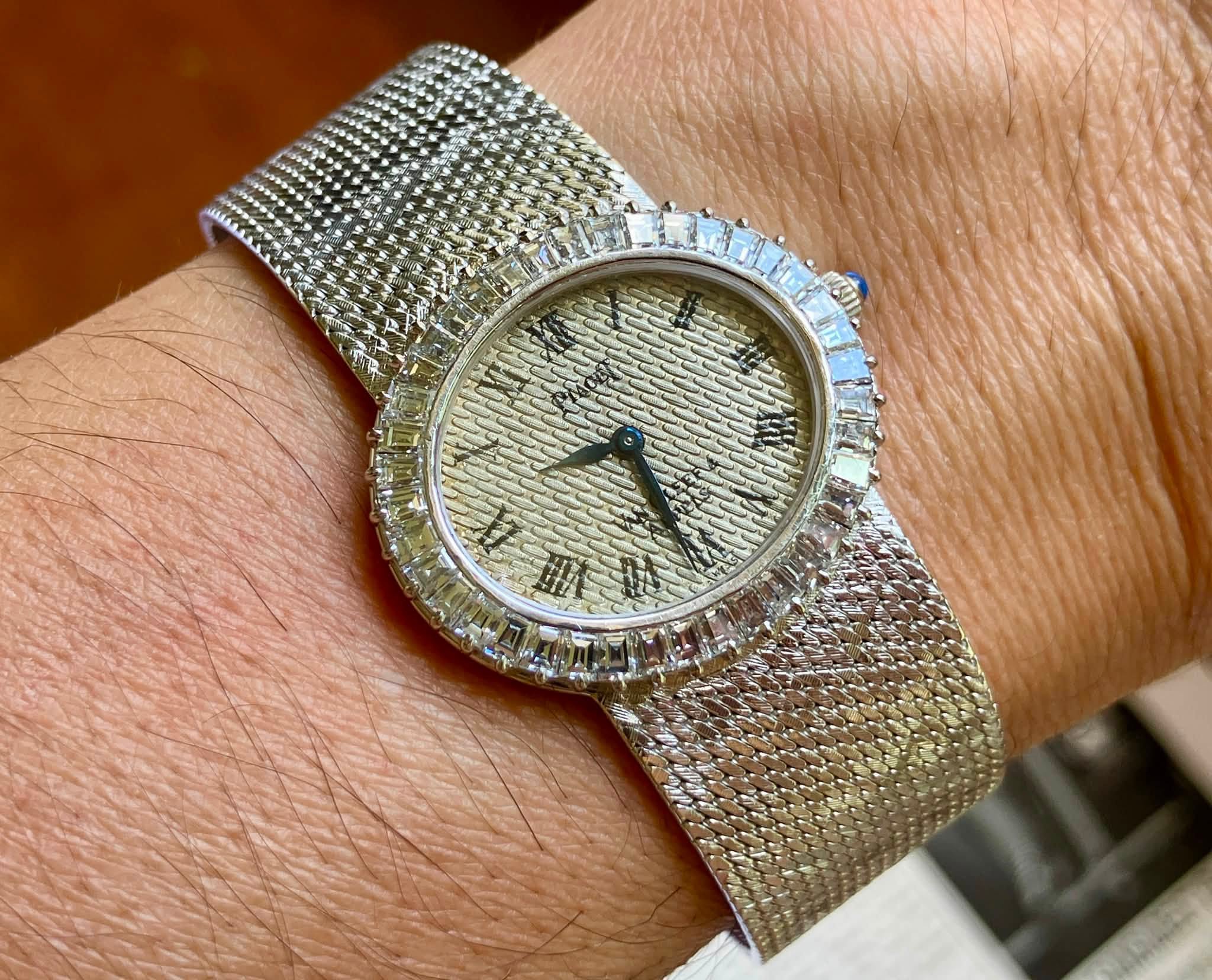 May be an image of wrist watch and text