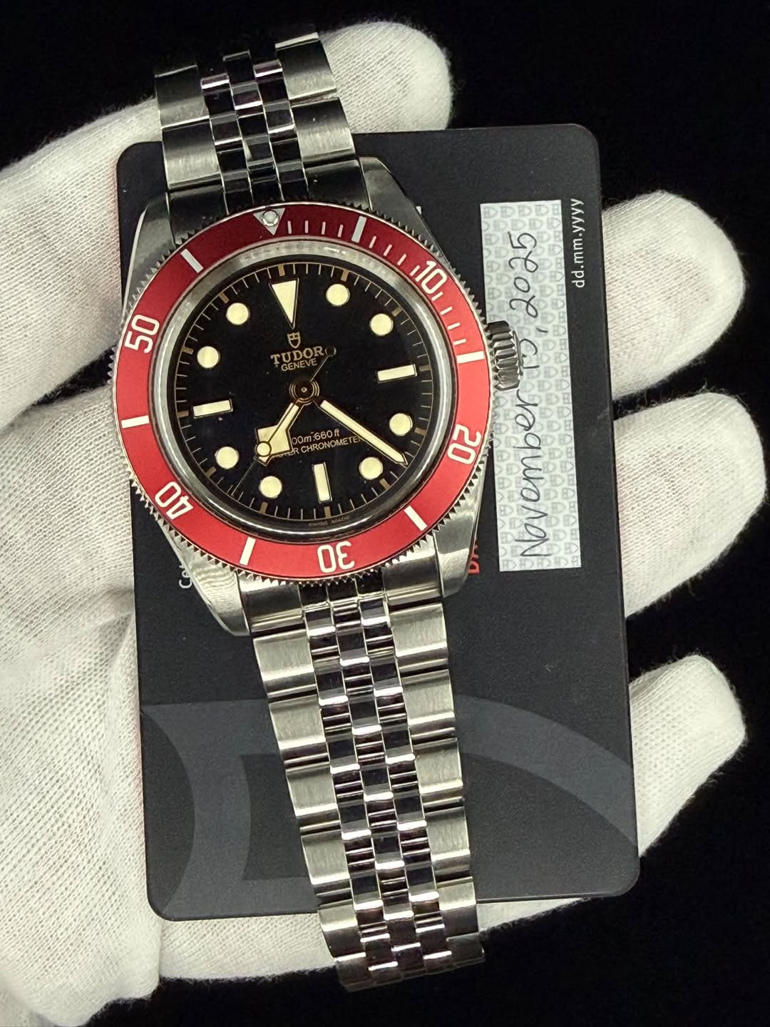 May be an image of wrist watch and text