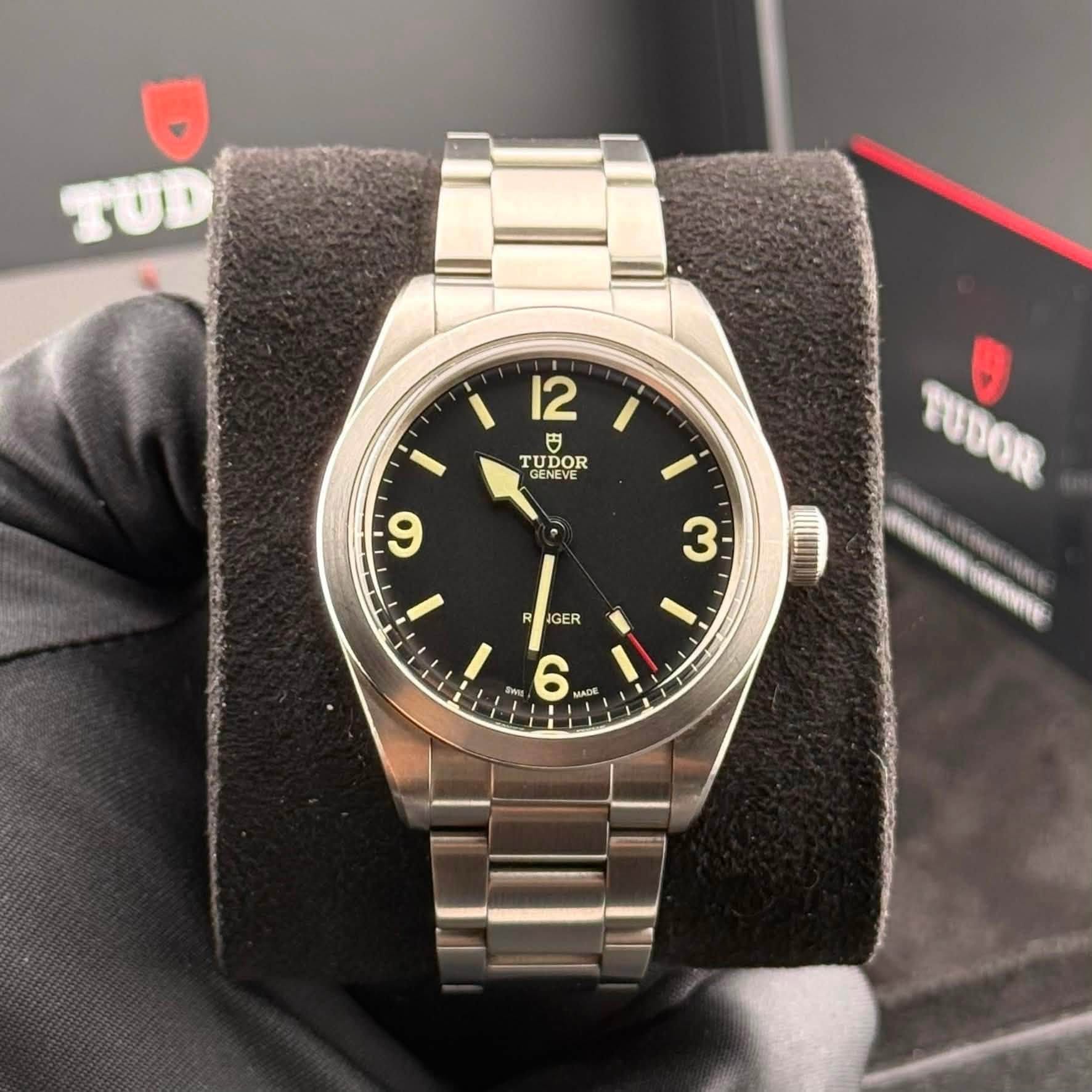 May be an image of wrist watch and text