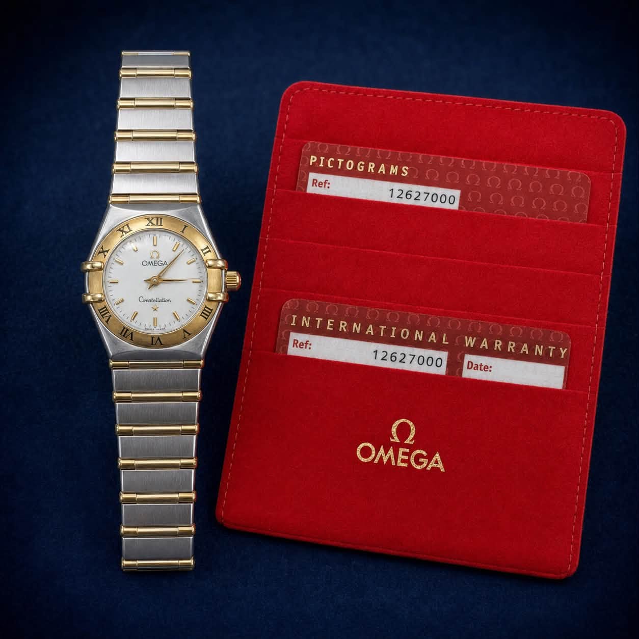 May be an image of wrist watch and text that says 'ー XII t 0 0 OMEGA PICTOGRAMS ၈၈၈၈၈၈၈၈ 요8유량량 Ref: 12627000 Comabolatimn E INTERNATIONAL Ref: 12627000 WARRANTY R Date: OMEGA'