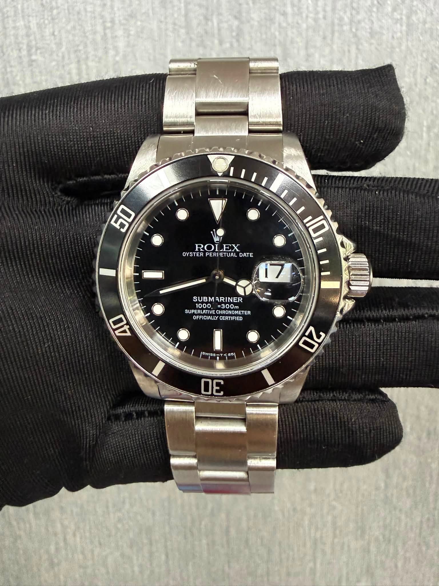 May be an image of wrist watch and text that says '50 H 10 ROLEX ROL EX OYSTER OYSTERPERI PERIETUR OYSTERPERIETUALDATE RIETUAL TUAL DATE 17 SUBMARINER SUBM ARINER SUPERLATIVE…