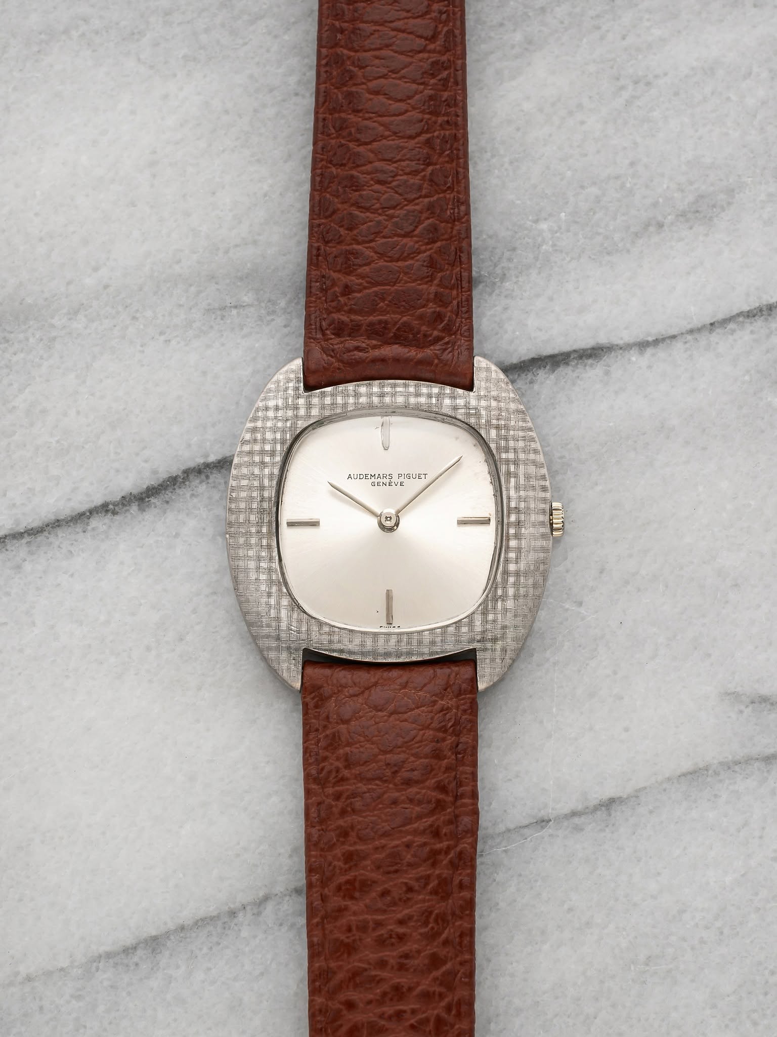 May be an image of leather and wrist watch