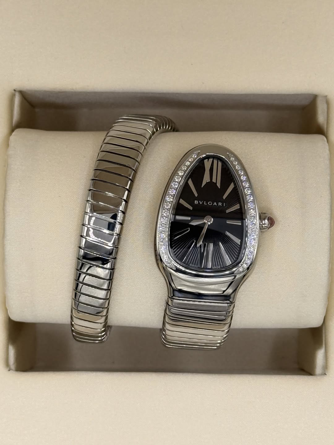 May be an image of digital watch, jewelry and text