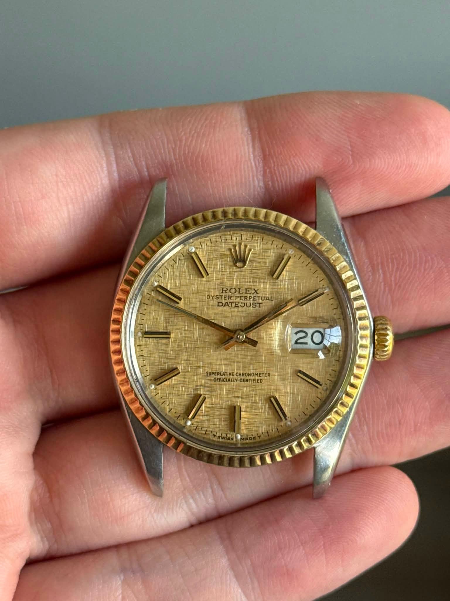 May be an image of wrist watch and text