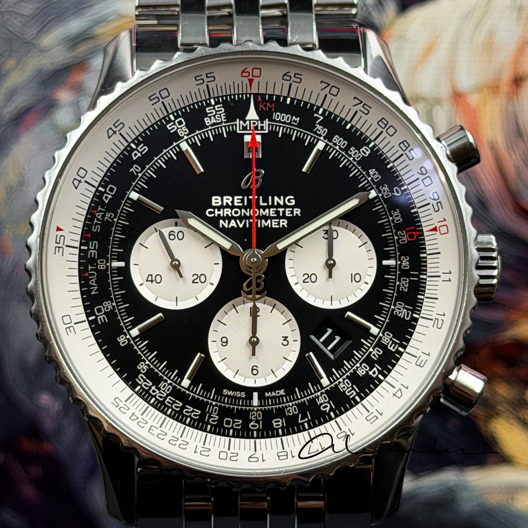 May be an image of wrist watch and text that says '60 50 55 יויוייוי BASE MPH 1000M BREI BREITLING LING CHRONOMET DMETER ER NAVI" MER NAUT 3ER സ Y 3 12 3 da Ne I D8 9 M O4 O la…