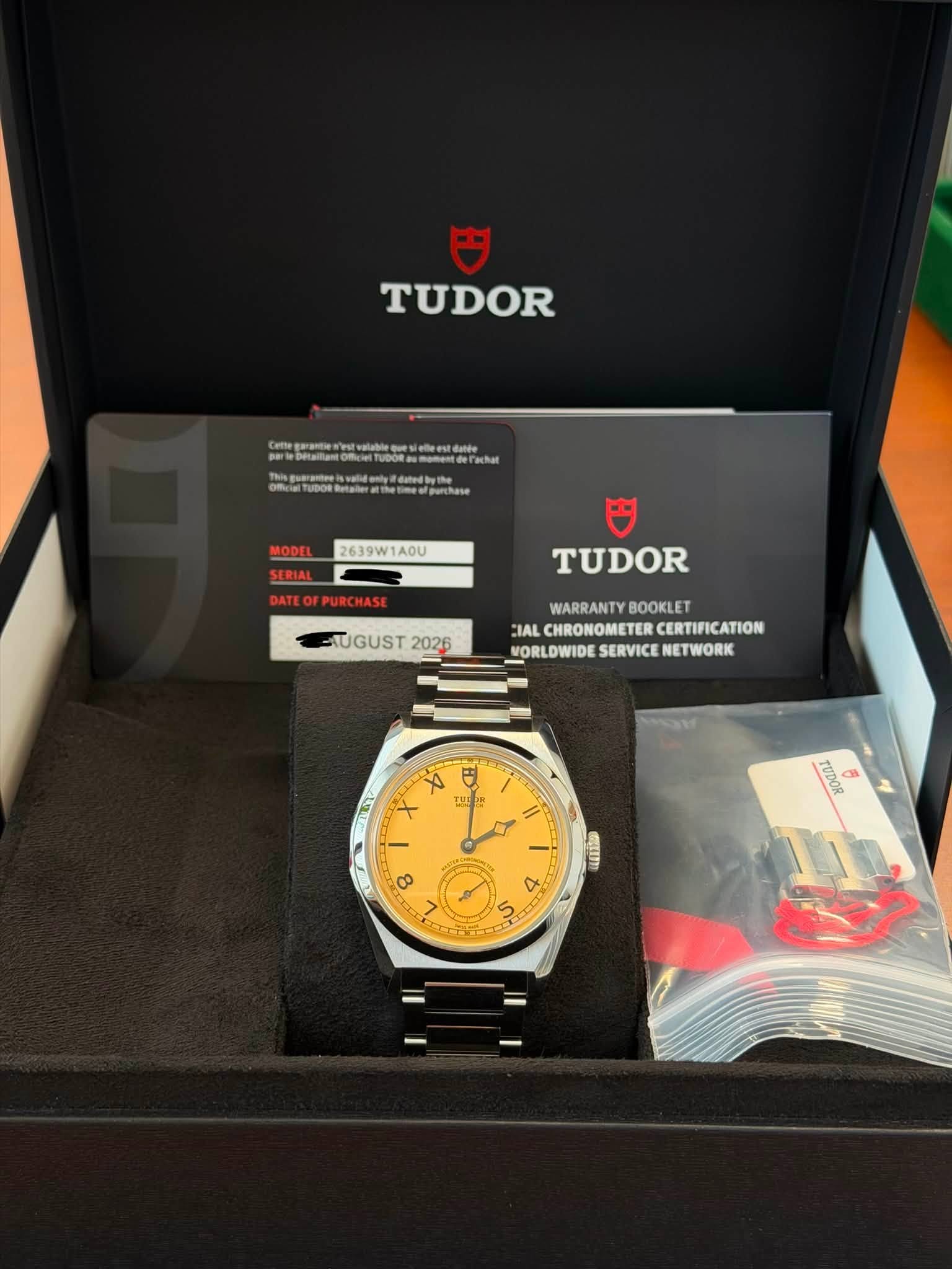 May be an image of wrist watch and text that says 'TUDOR 2639W1A0U OFPURCHASE TUDOR HUGUST2026 2026 WARRANTY IAL IALCHROMOMETERCERTIFICATION CHRONOMETER CERTIFICATION…