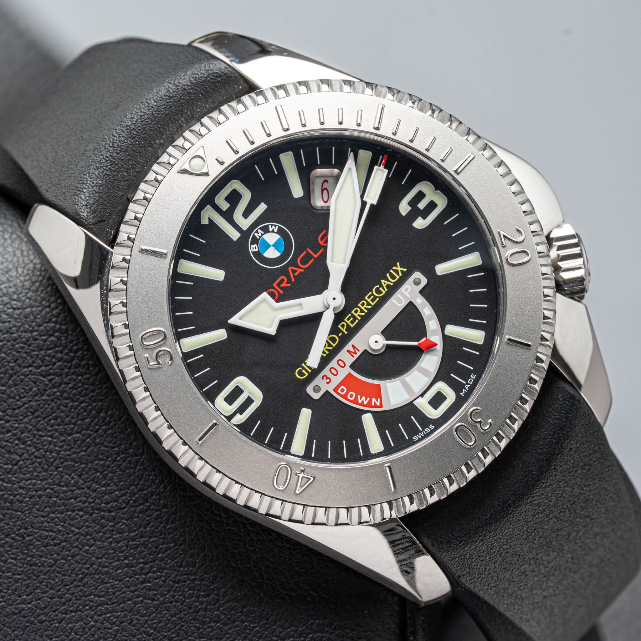 May be an image of wrist watch and text that says '20 b 12 M M PRACLE W ท ORACL PERREGAUX UP スD 9 GI 300 300M M 9 OW NN I i 50 AC 0 S SWISS'