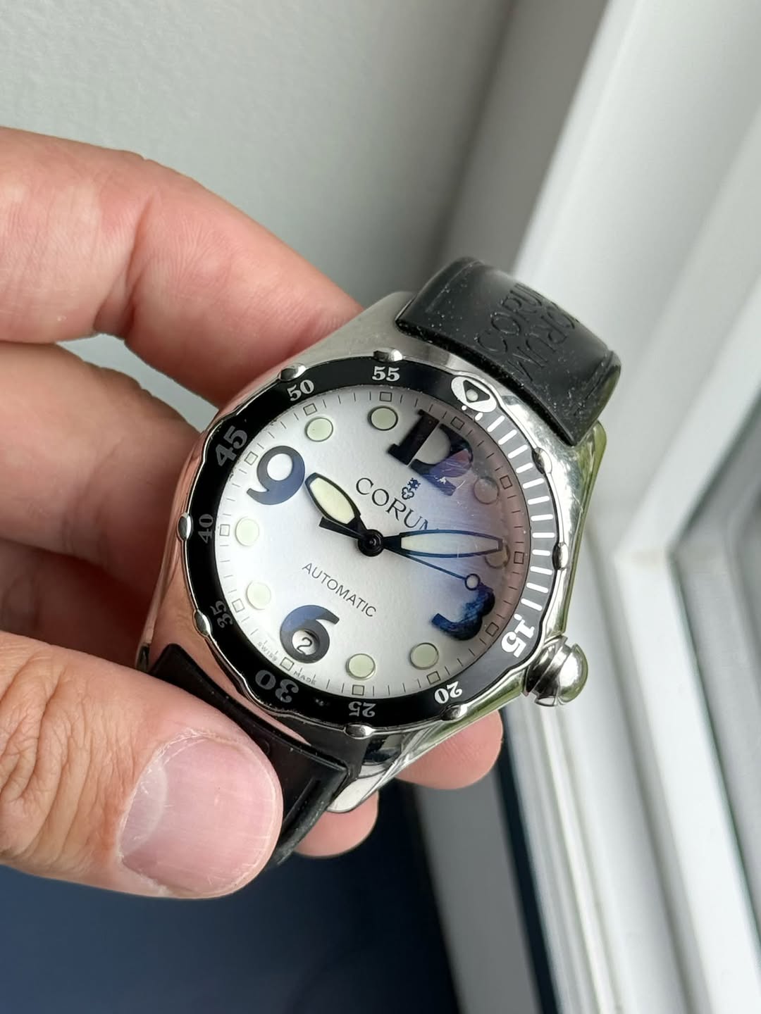 May be an image of digital watch and text